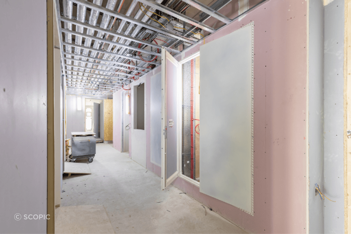 A Standard AccessDor riser door panel installed during construction.