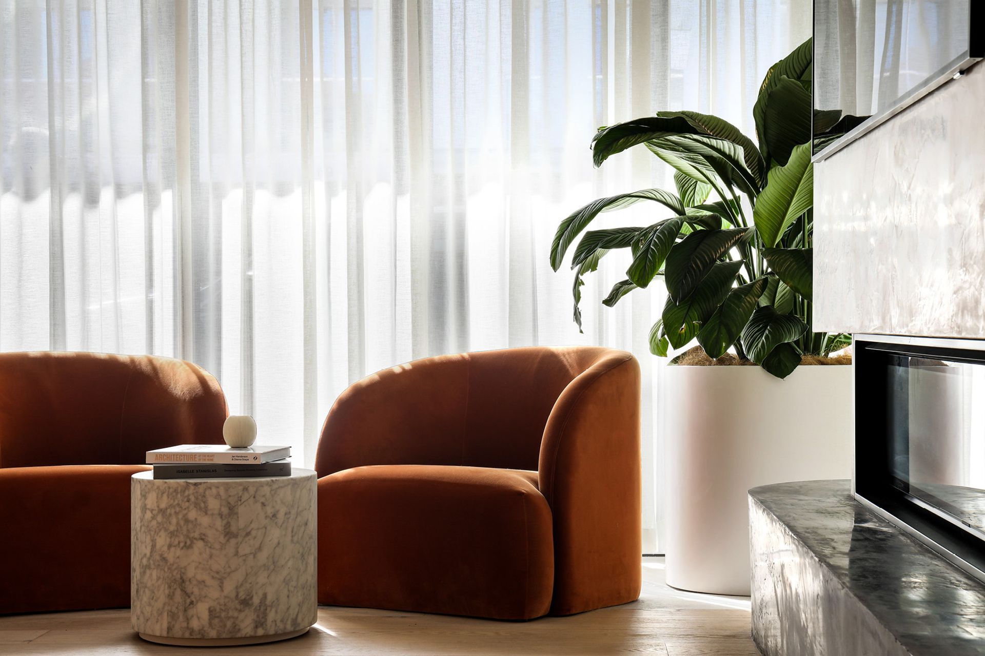 Pictured here: Kennedy Beckett Sofa Chair and Elle Block Round Side Table