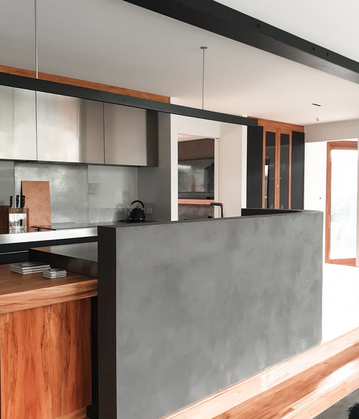 Dark polished plaster kitchen island completed by Claddagh Plastering Ltd