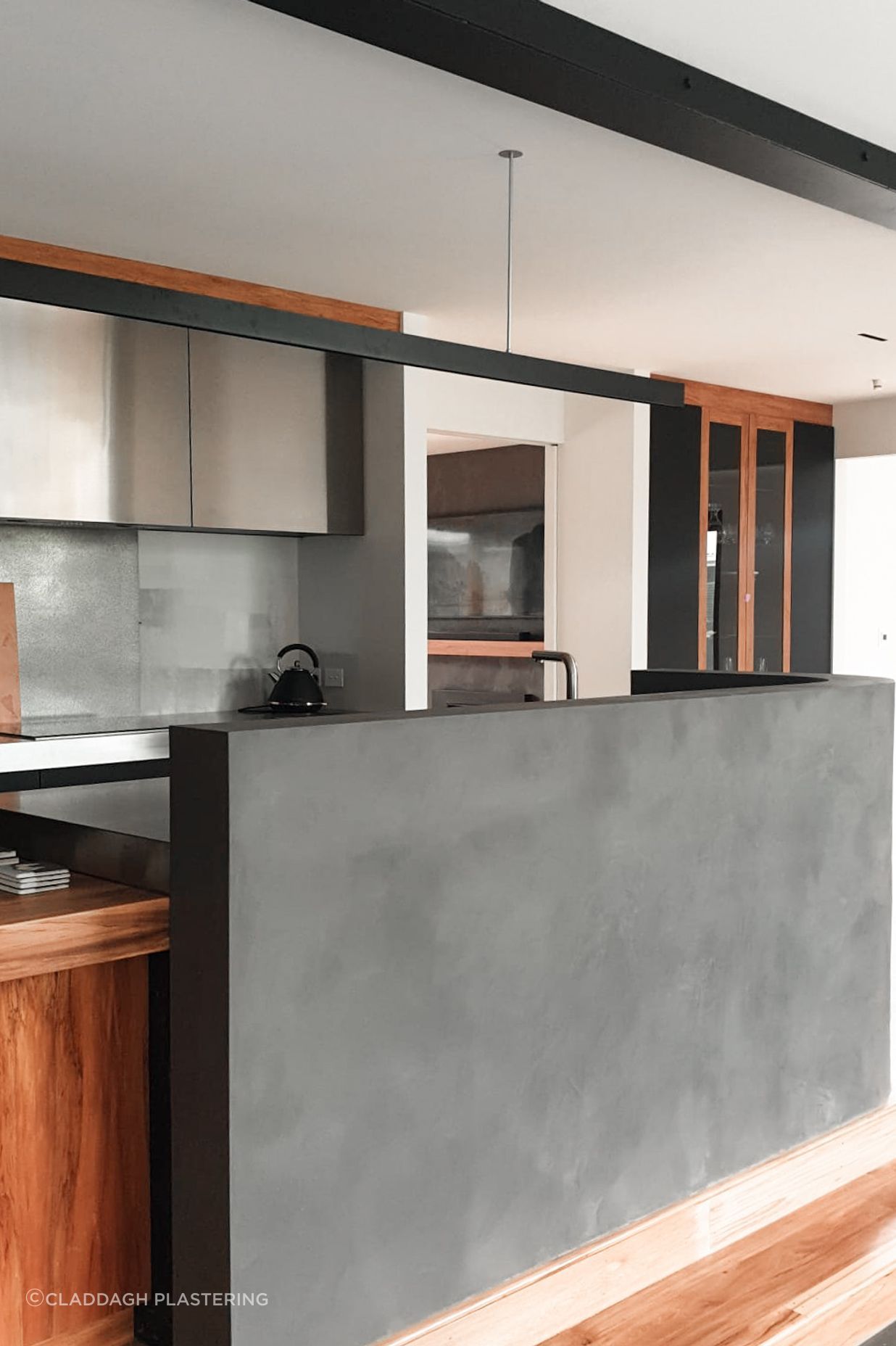 Dark polished plaster kitchen island completed by Claddagh Plastering Ltd