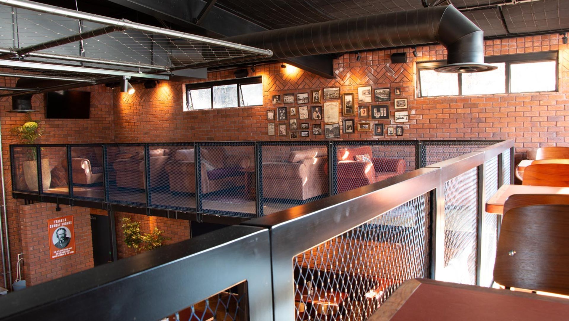 Morningside Tavern - balustrades and mesh ceiling feature banner