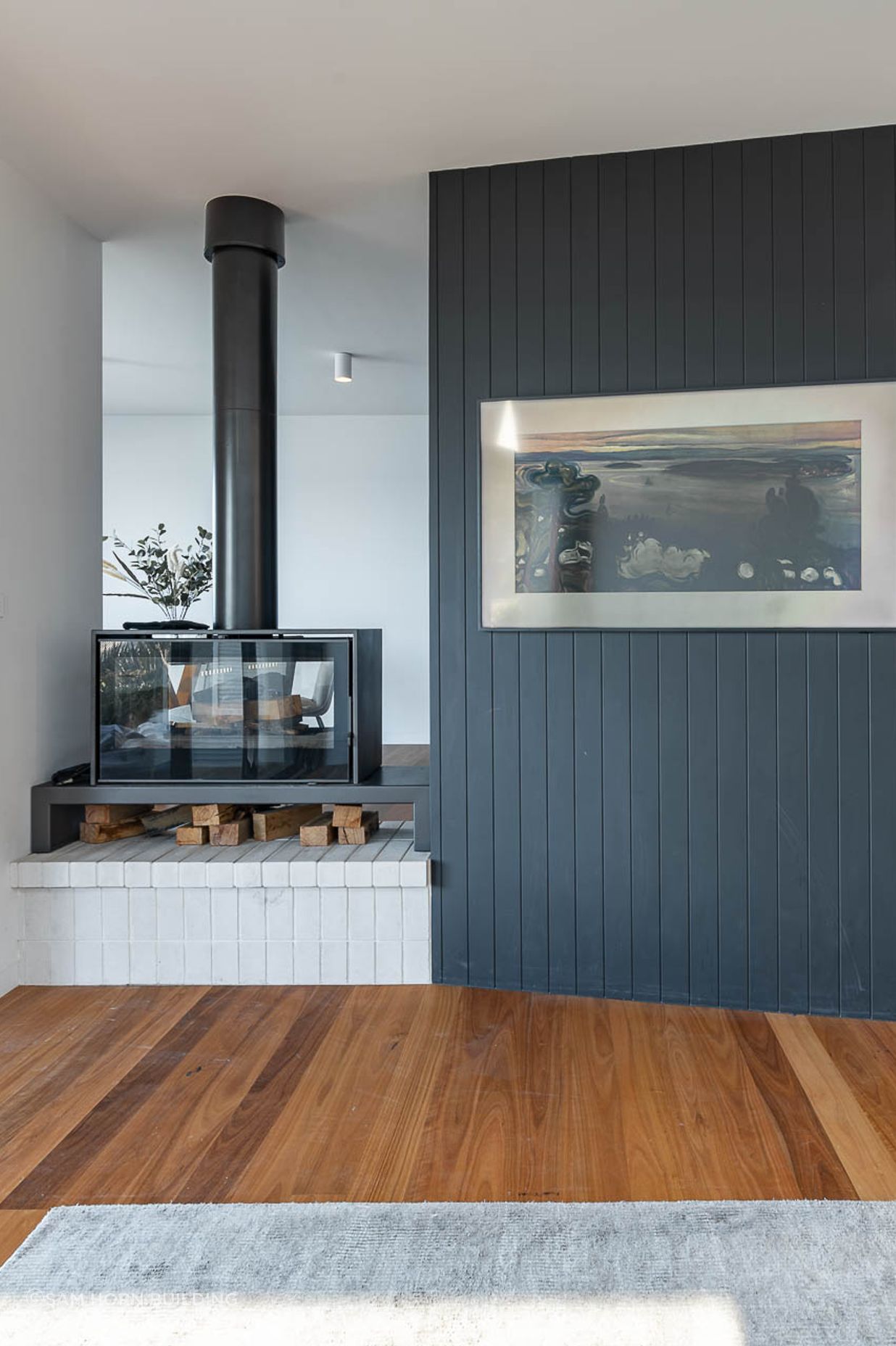 The Axis i1000FS Double Sided fireplace's sleek and modern design, seamlessly blends with the homes' functionality and style
