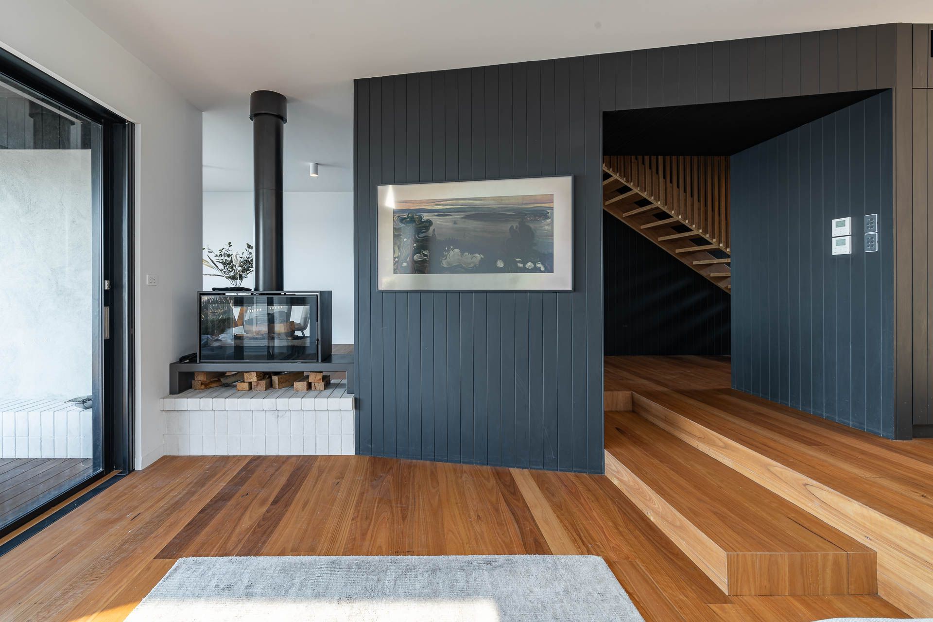 The Axis i1000FS Double Sided fireplace's sleek and modern design, seamlessly blends with the homes' functionality and style