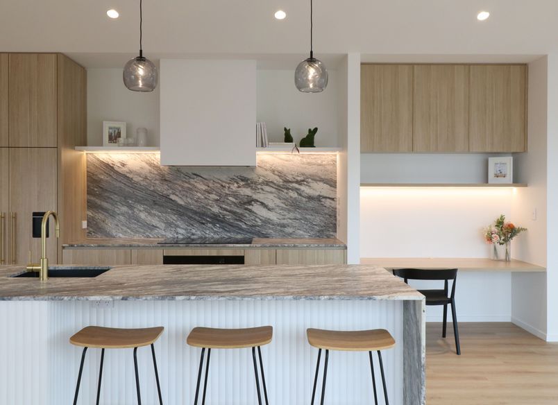 Curved Timber Island with Leathered Granite Elegance