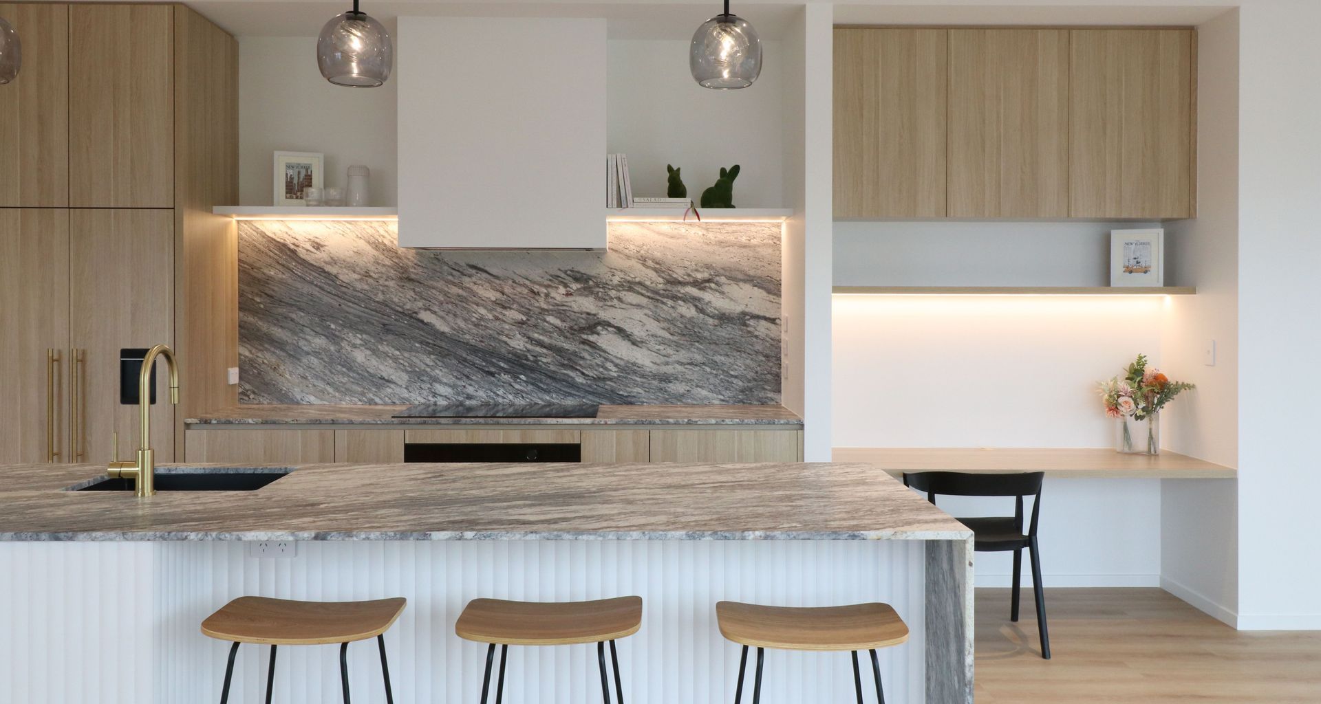 Curved Timber Island with Leathered Granite Elegance banner