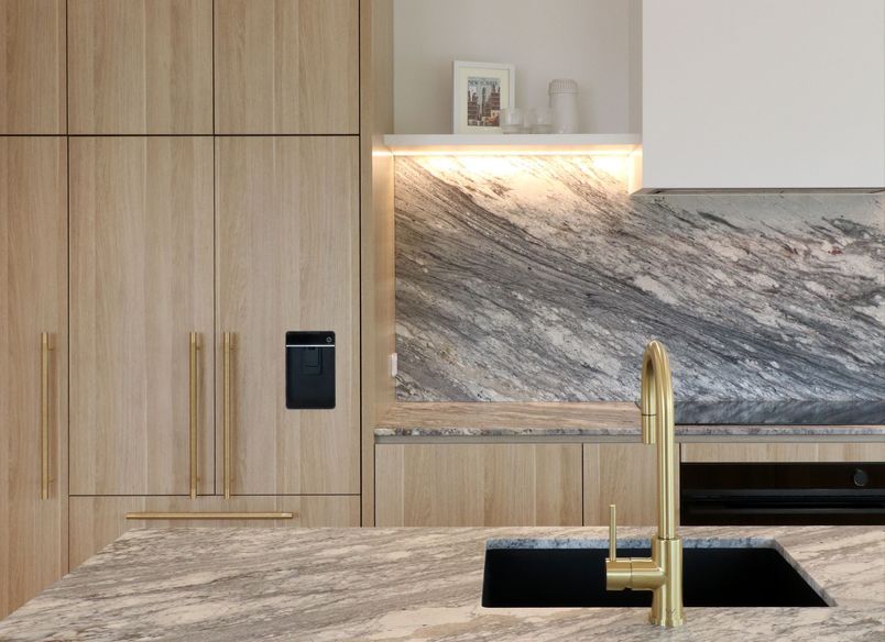 Curved Timber Island with Leathered Granite Elegance