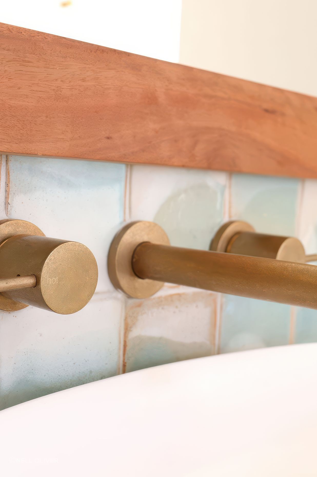 Bathroom Tiles seamlessly tie in with the tap ware.