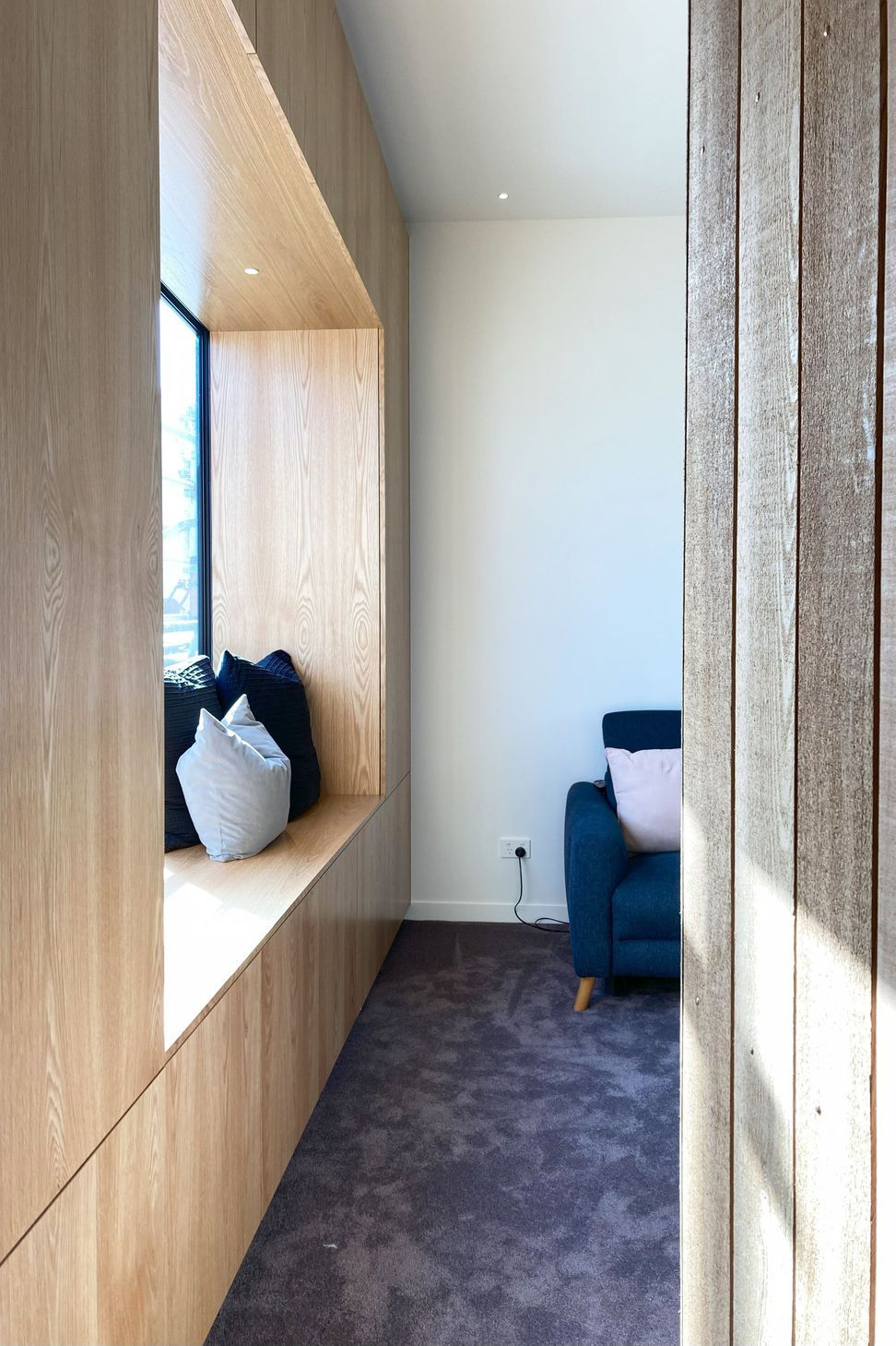 White V groove, black island and a scullery with a touch of pink