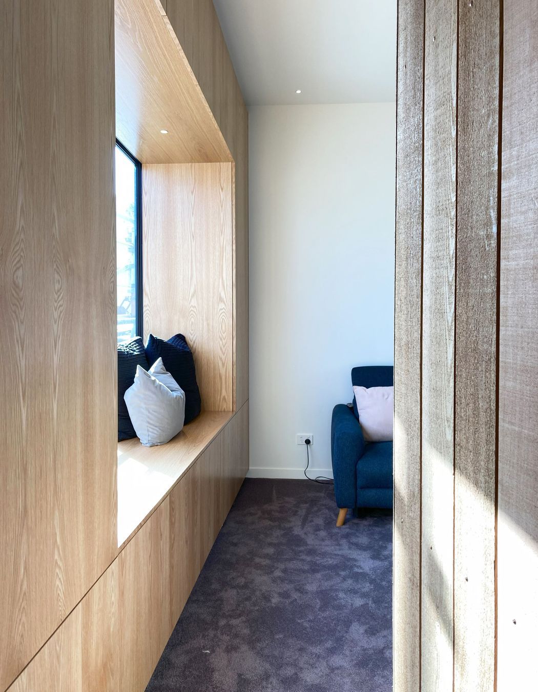 White V groove, black island and a scullery with a touch of pink