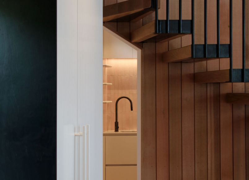 White V groove, black island and a scullery with a touch of pink