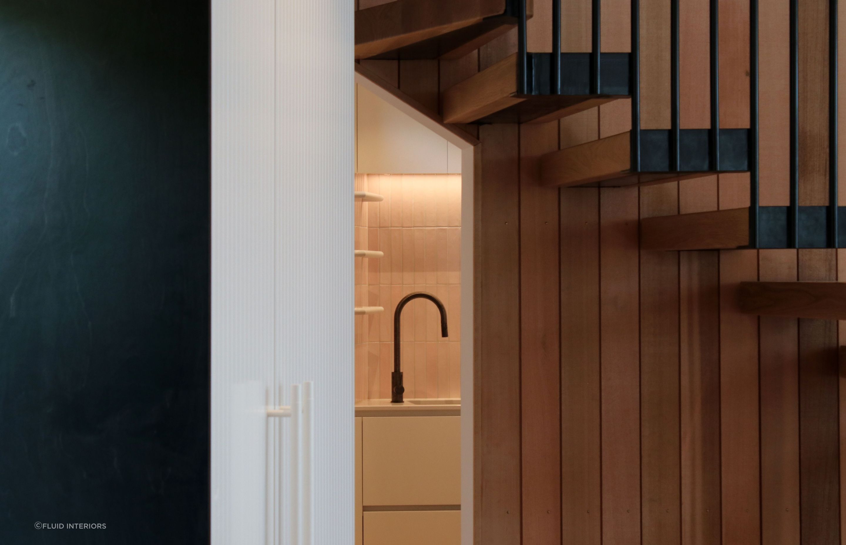White V groove, black island and a scullery with a touch of pink