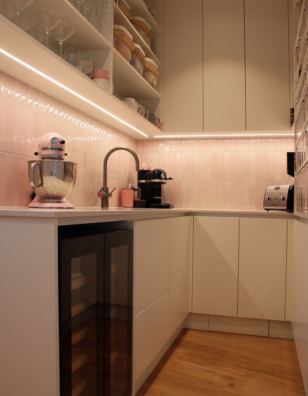 White V groove, black island and a scullery with a touch of pink