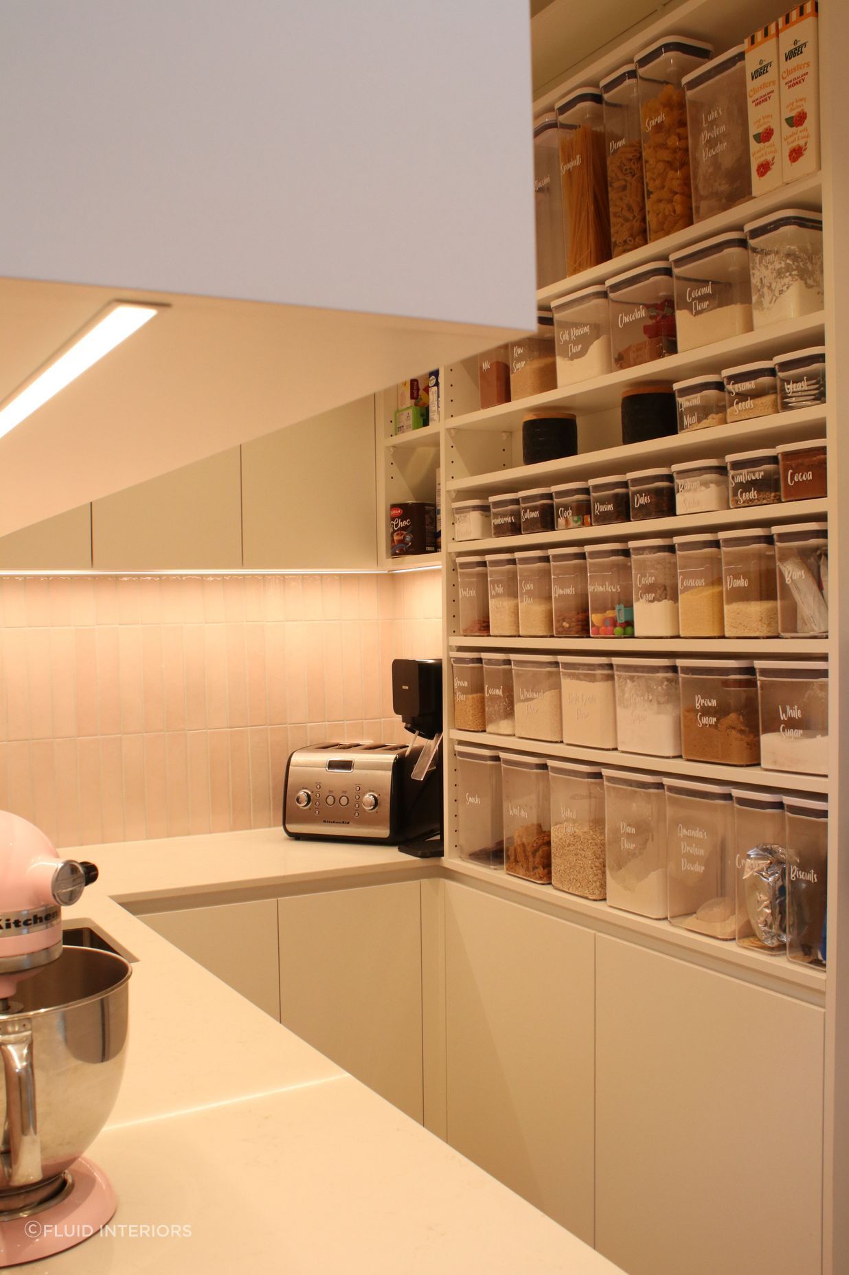 White V groove, black island and a scullery with a touch of pink