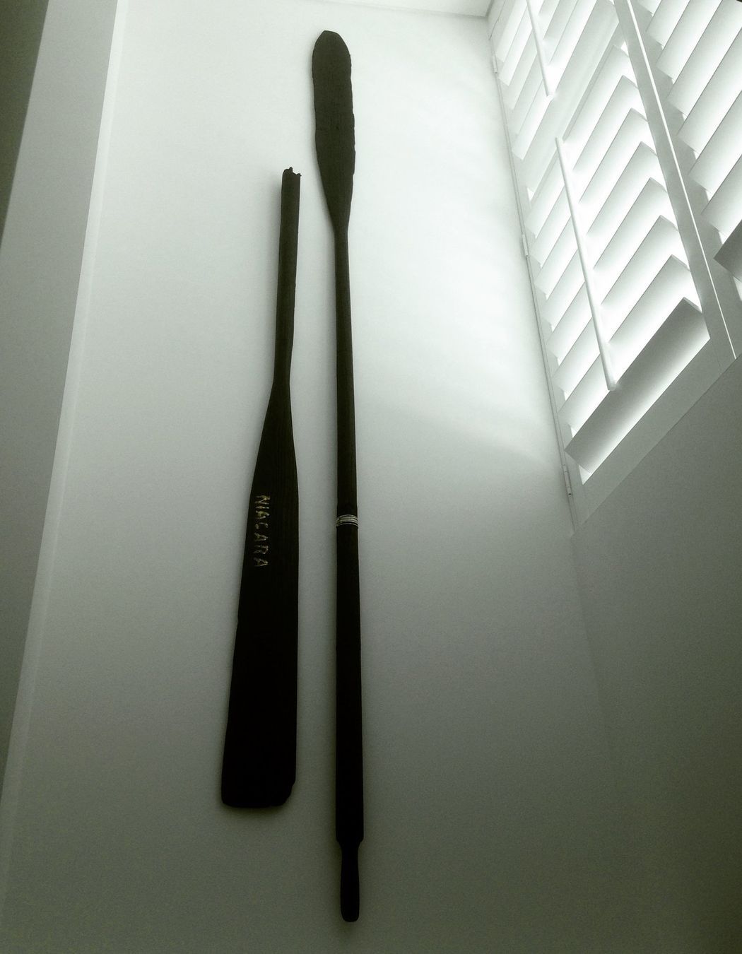 Niagara - 2400 x 400 x 60mm. Wall hung de-commissioned antique oars. Blackened and embellished with sterling silver, gold-dust and copper. Private collection, The Hilton Apartments, Auckland, New Zealand. Copyright JohnOxborough FineArt & Interiors 2