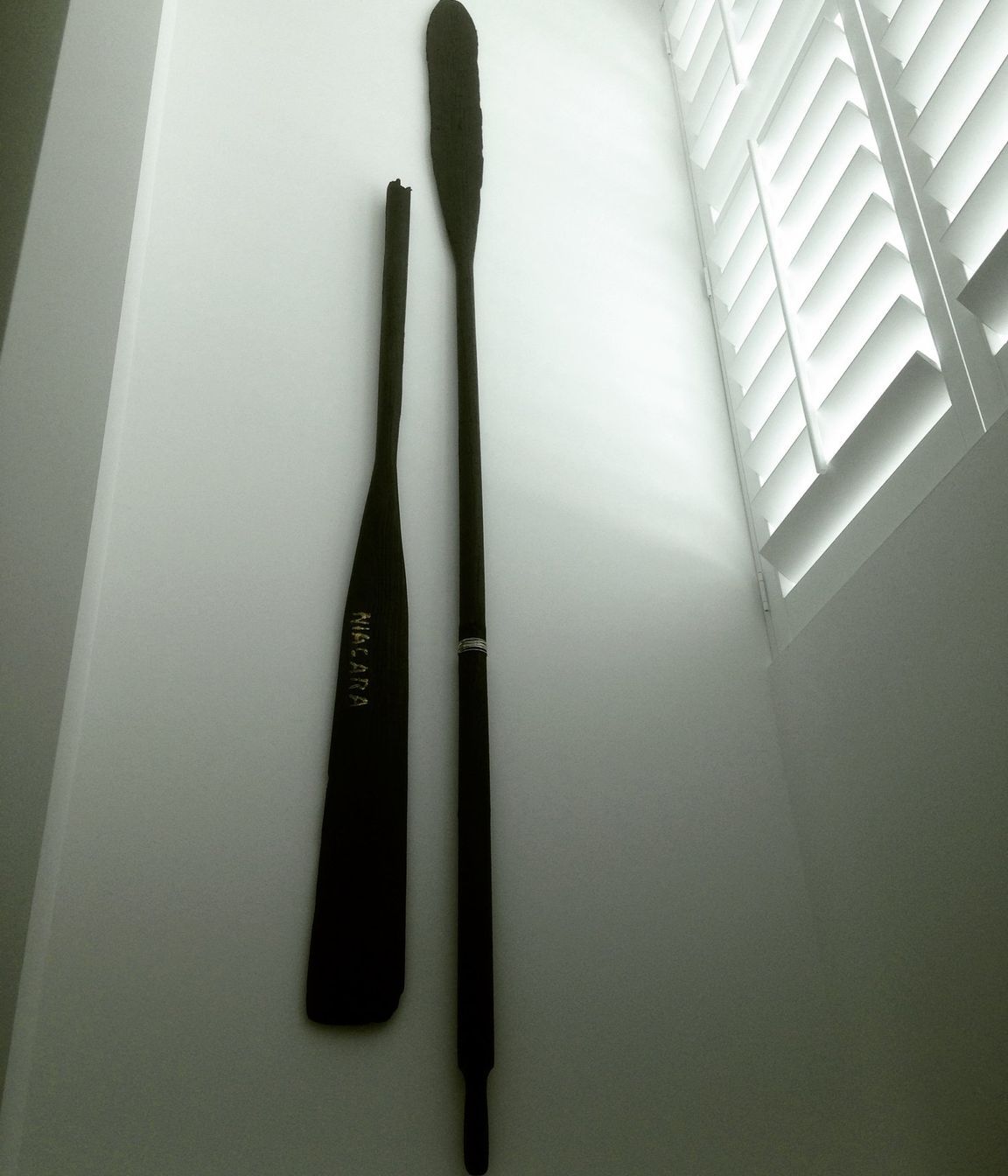 Niagara - 2400 x 400 x 60mm. Wall hung de-commissioned antique oars. Blackened and embellished with sterling silver, gold-dust and copper.  Private collection, The Hilton Apartments, Auckland, New Zealand. Copyright JohnOxborough FineArt &amp; Interiors 2