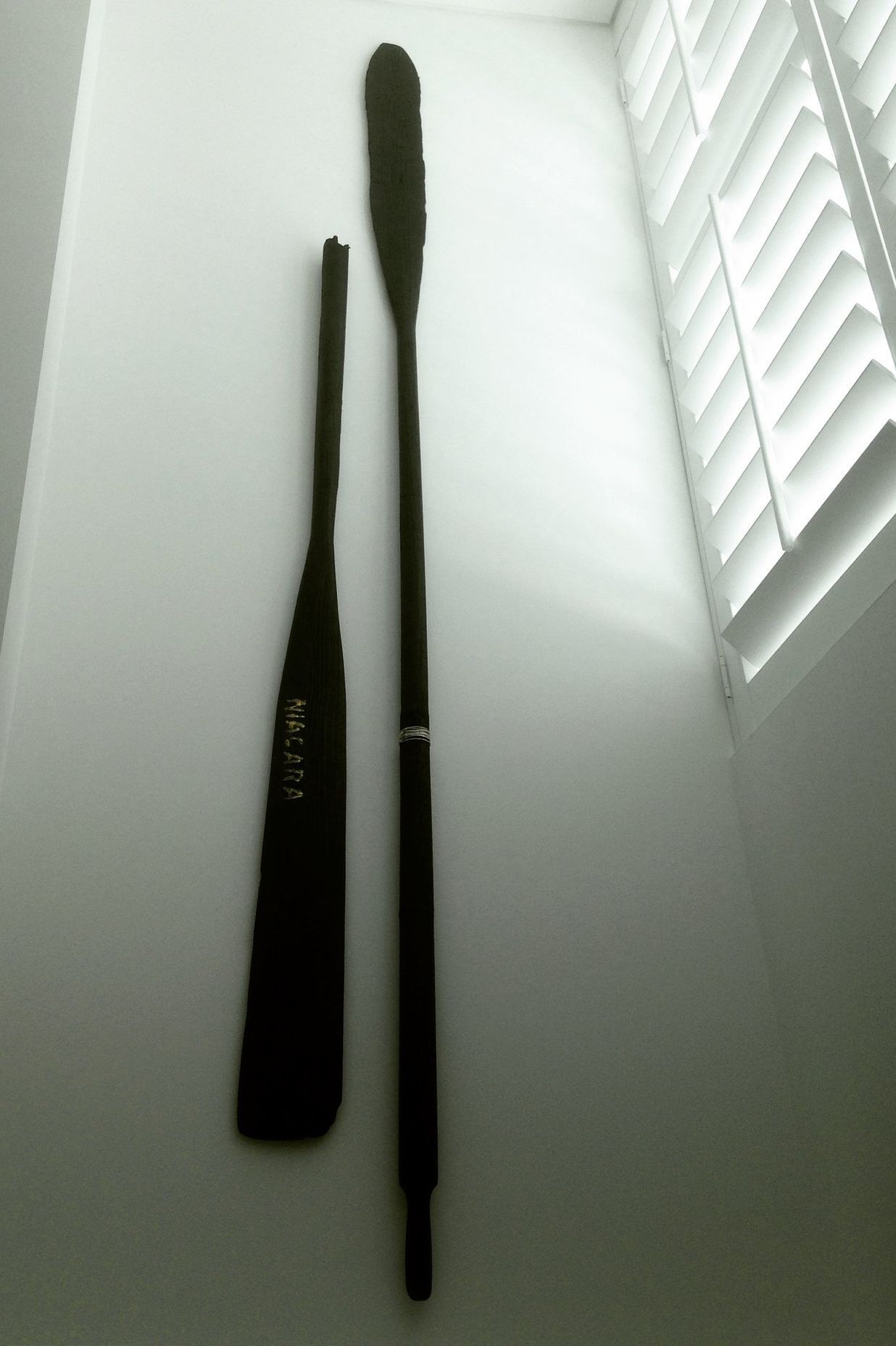 Niagara - 2400 x 400 x 60mm. Wall hung de-commissioned antique oars. Blackened and embellished with sterling silver, gold-dust and copper. Private collection, The Hilton Apartments, Auckland, New Zealand. Copyright JohnOxborough FineArt & Interiors 2