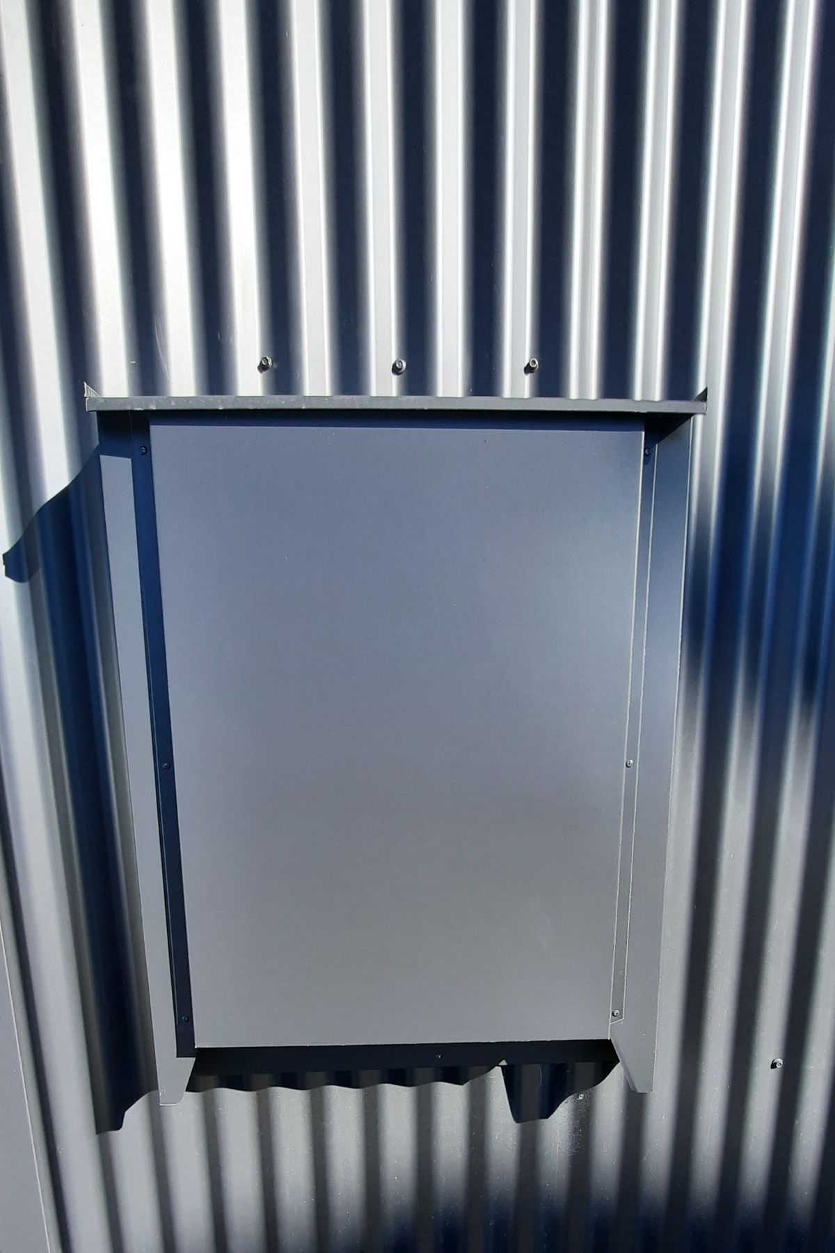 Precise metal folding detail to hide the power box on the visible street side