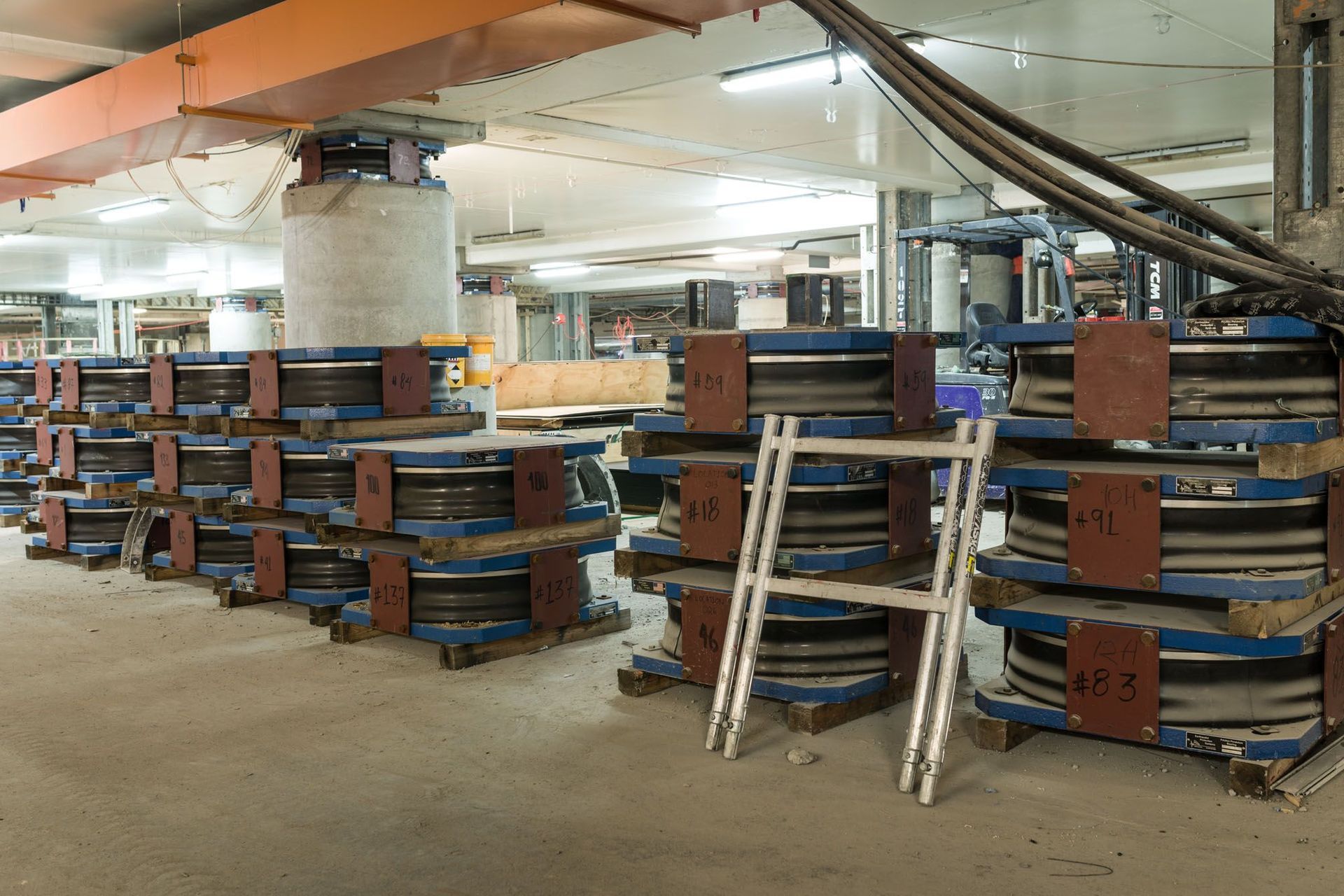 Triple curvature base isolation devices delivered to the Christchurch Art Gallery basement for installation