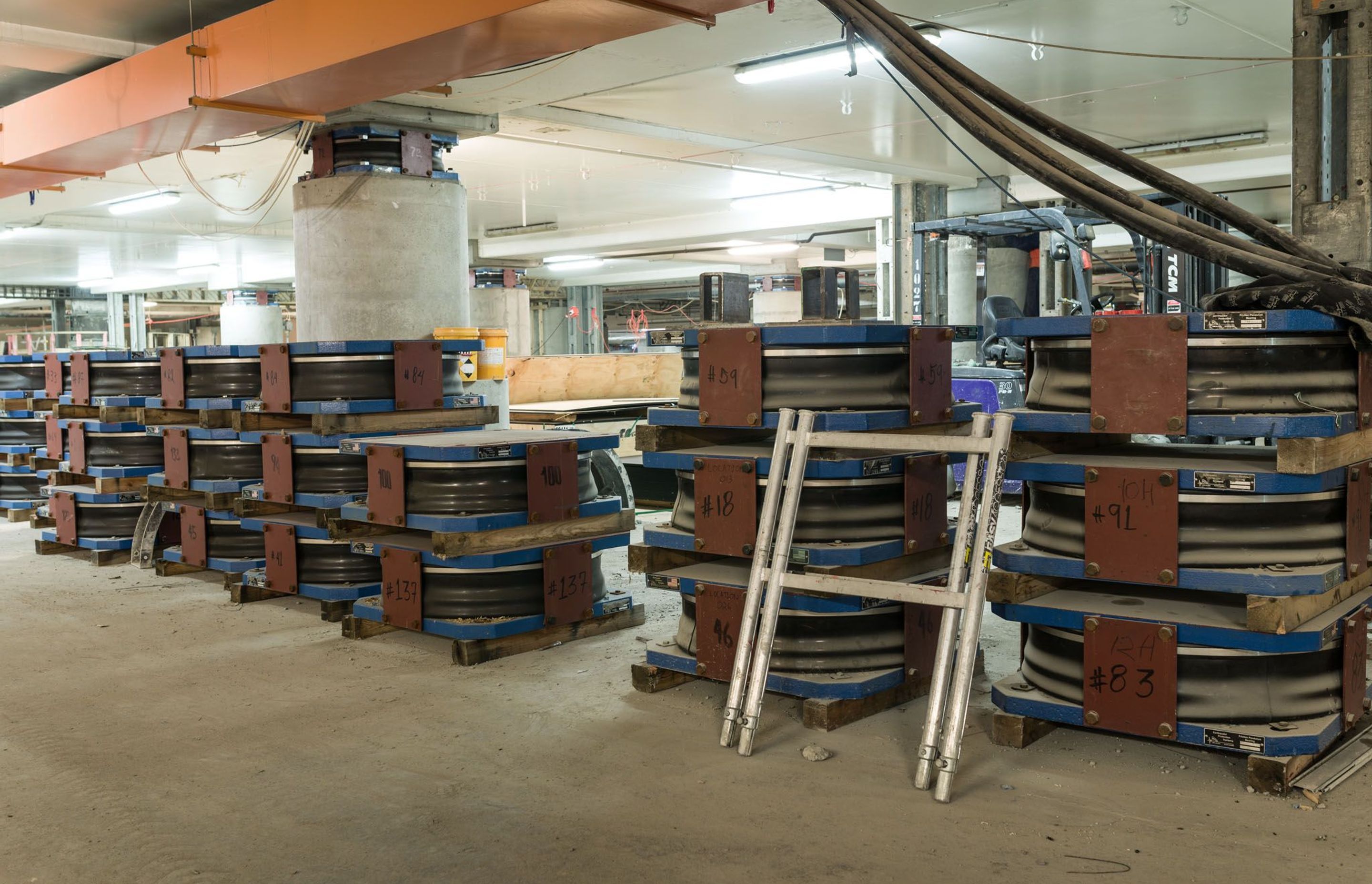 Triple curvature base isolation devices delivered to the Christchurch Art Gallery basement for installation