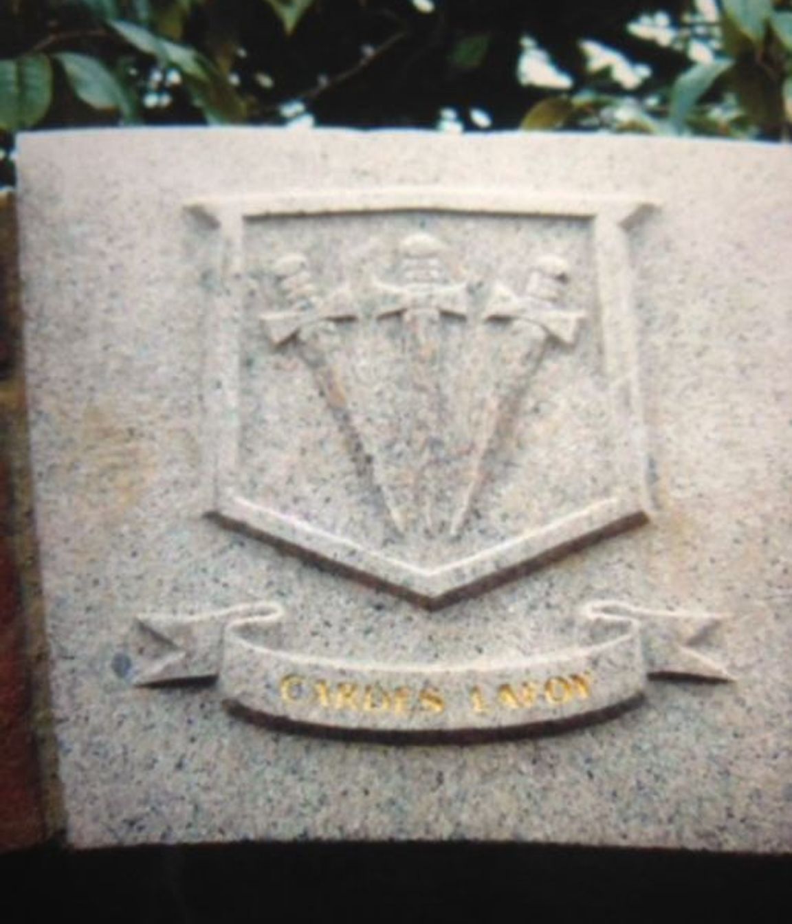 Carved family coat of arms in granite by Paul Gautron