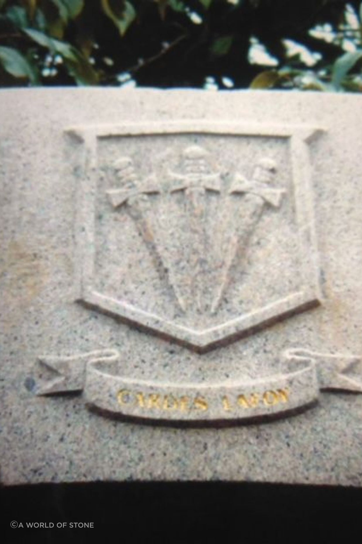 Carved family coat of arms in granite by Paul Gautron