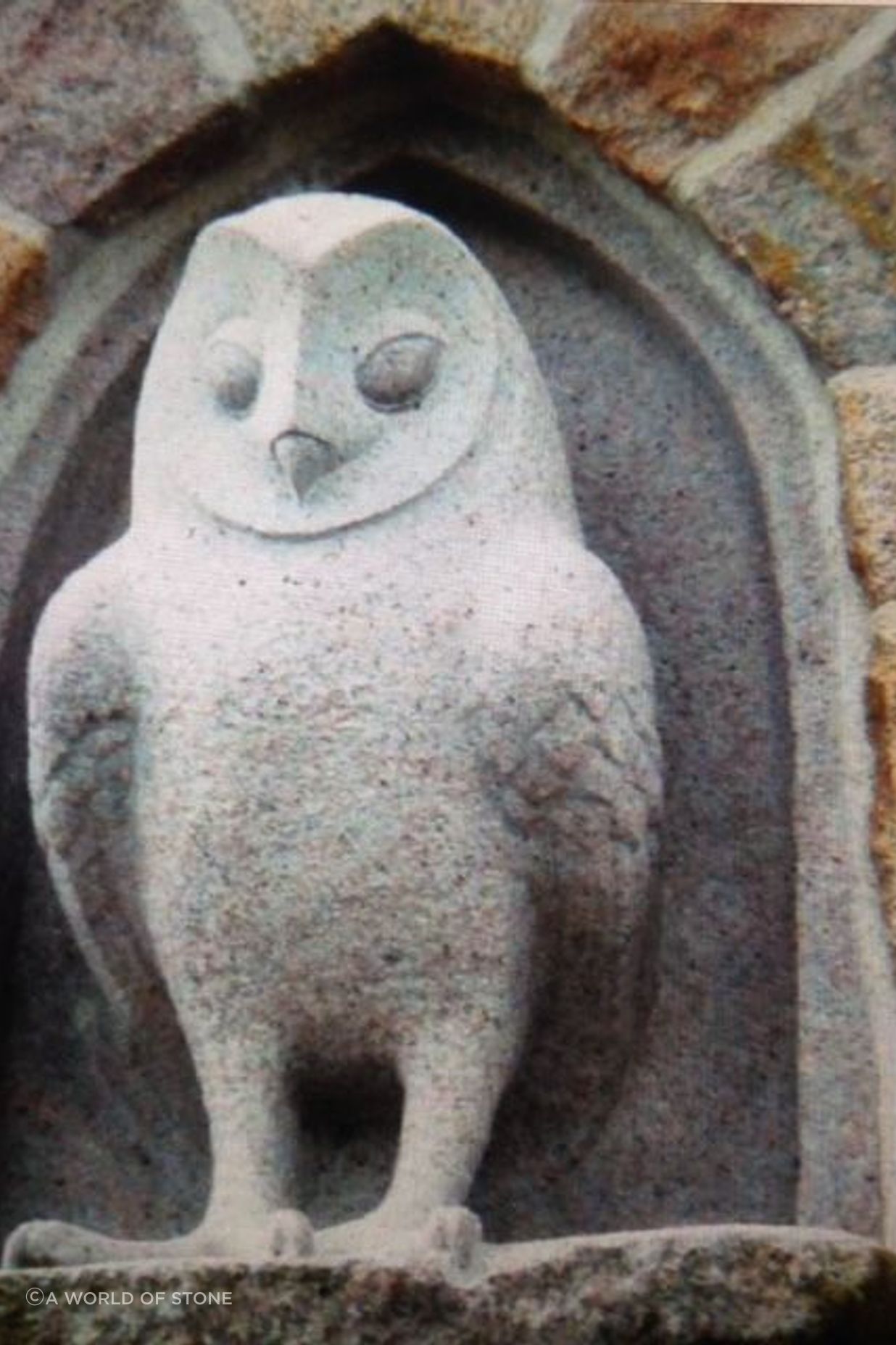 Carved granite owl and arch By Paul Gautron