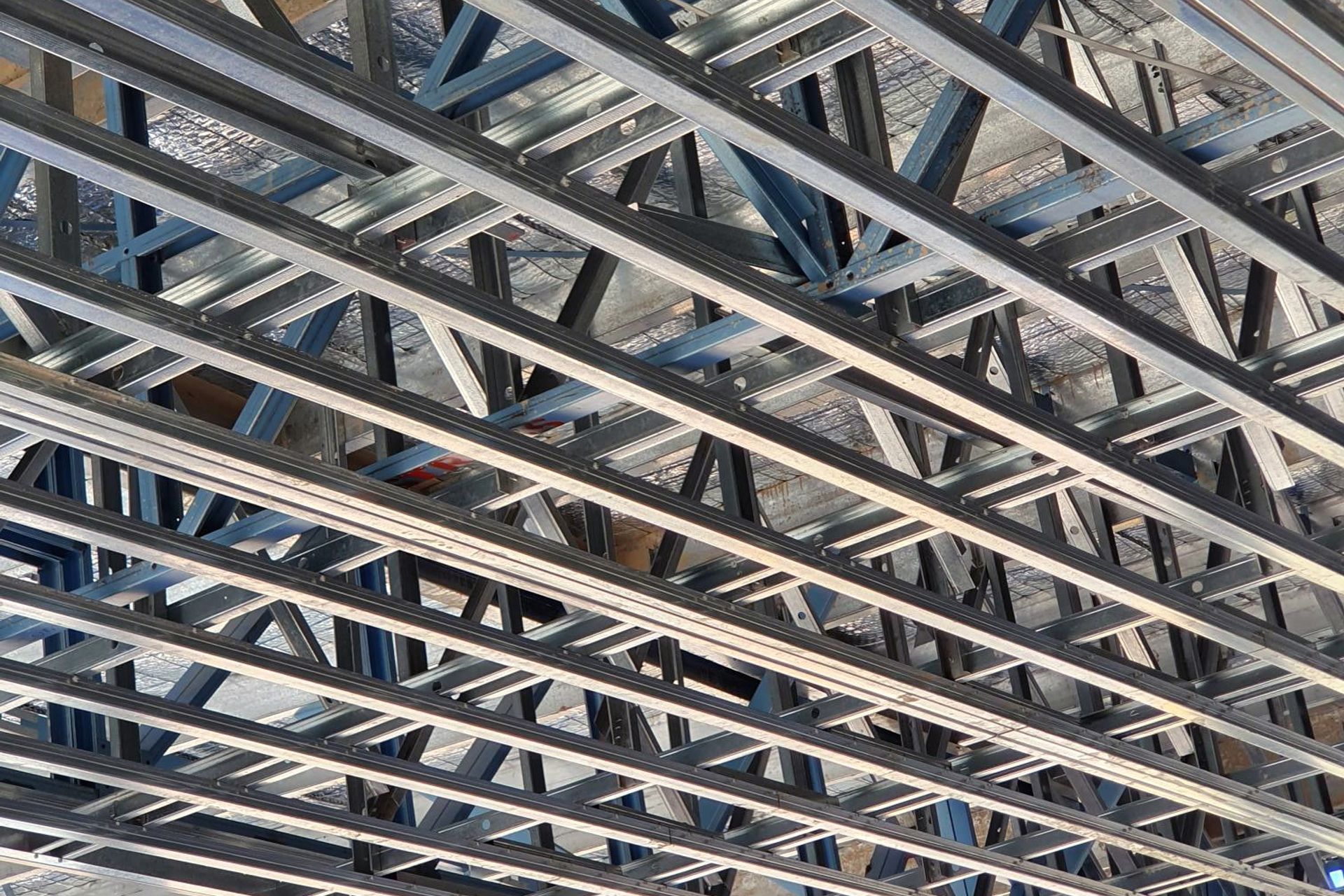 Outdoor ceilings subject to external wind pressure are framed with Studco top hats for maximum strength.