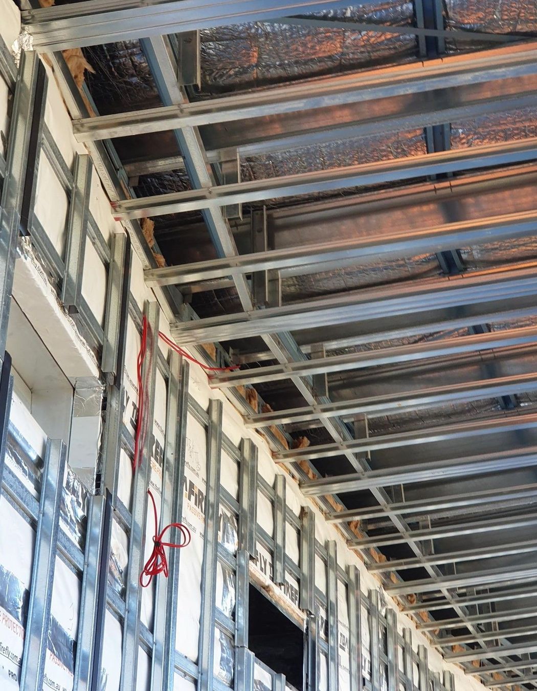 Studco top hat sections support the curved façade of the building.
