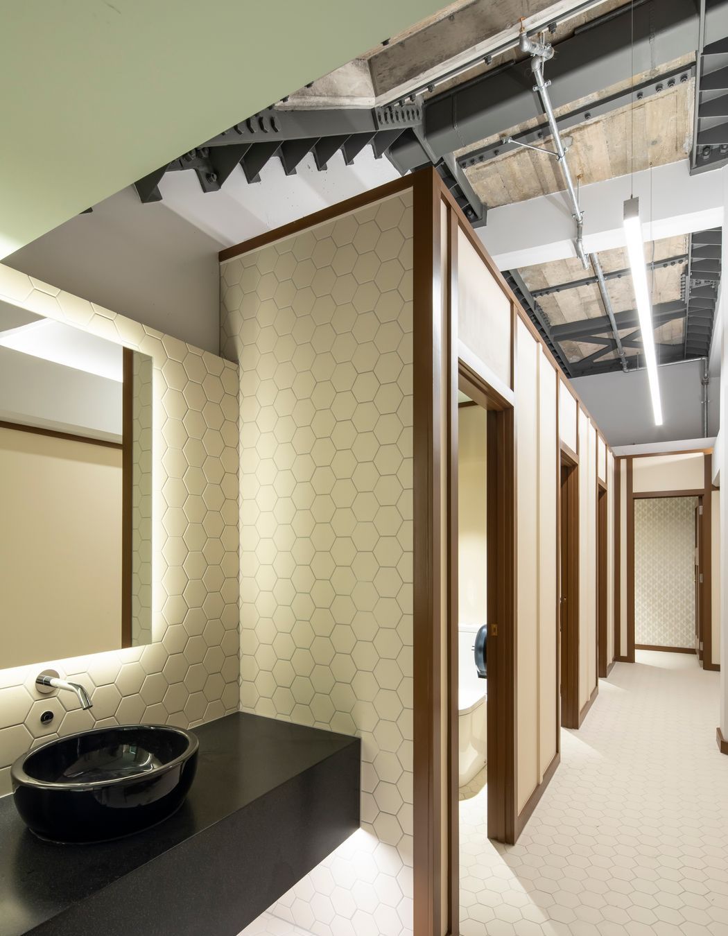 In this toilet area the new steel structure has been exposed at ceiling level as evidence of the upgrading/strengthening works that were carried out and which are, in most instances, completely concealed.