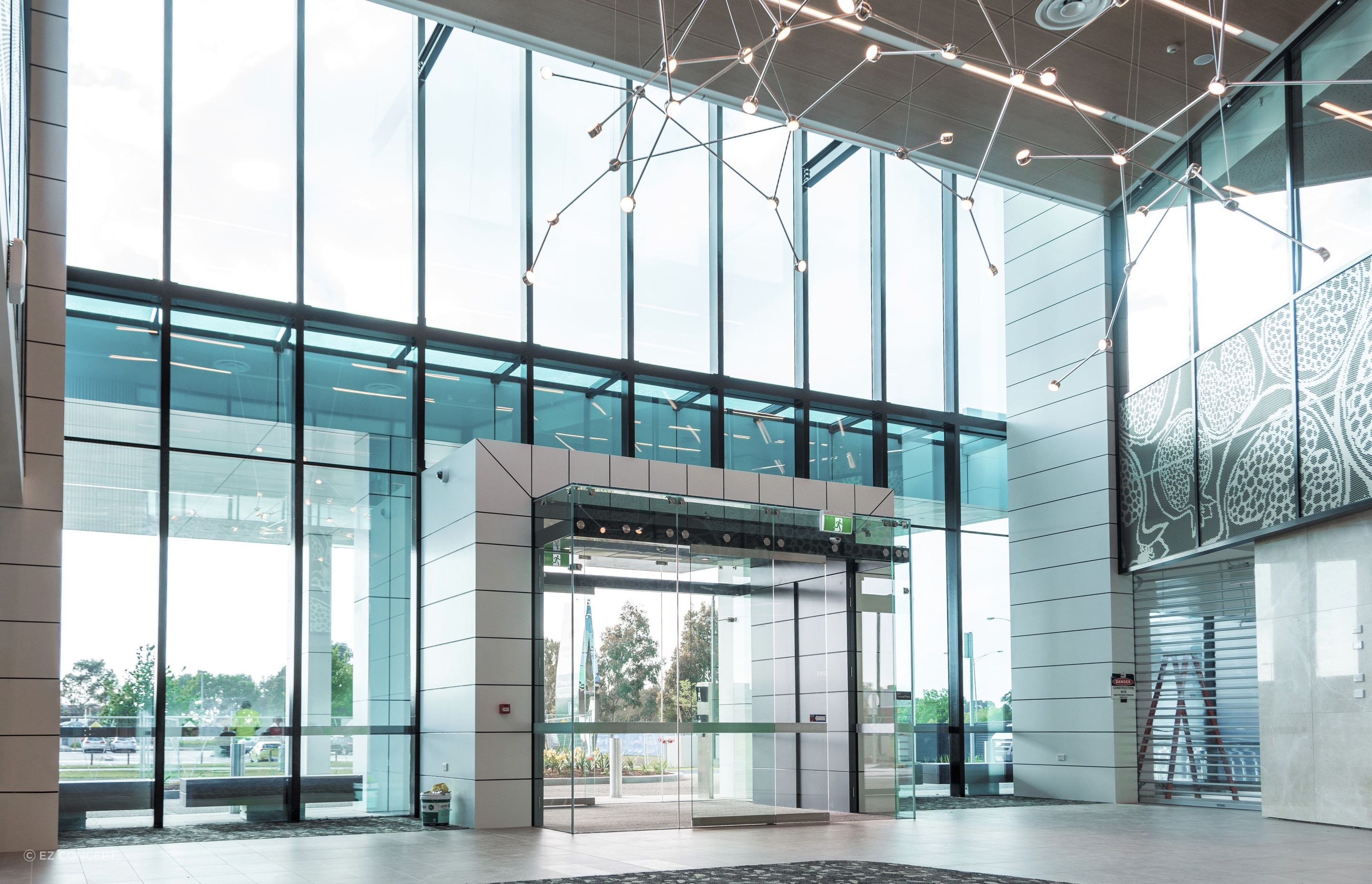 The 10m high framing of the lobby (pictured) is supported by the HEDA Tough Wall System.