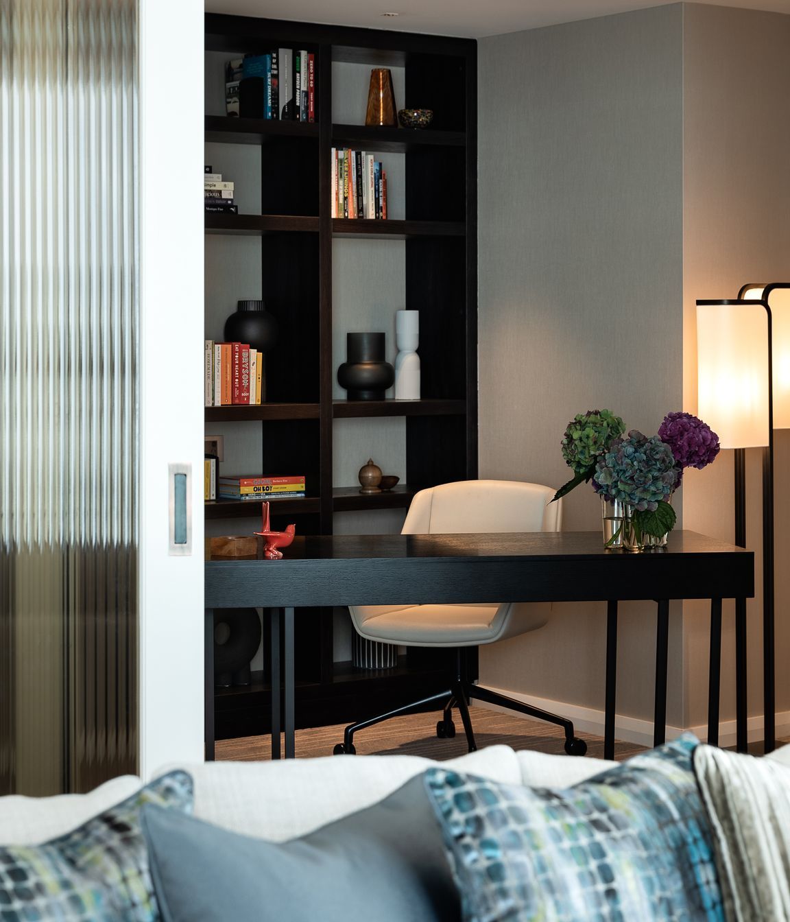 The Chairman suite features an office space complete with library shelving.