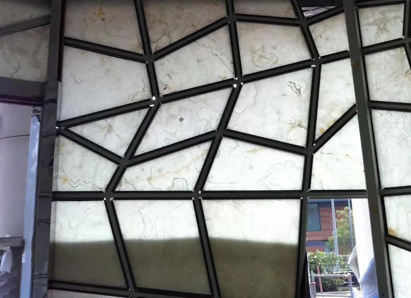 Raffles Hotel – Jewel Box Entrance Enhanced by Lamina Stone