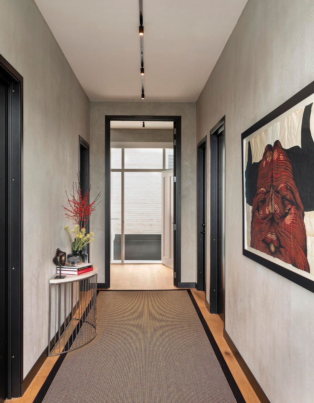 The entry hallway was elevated with textured walls and a fascinating bull artwork by David Ellis.