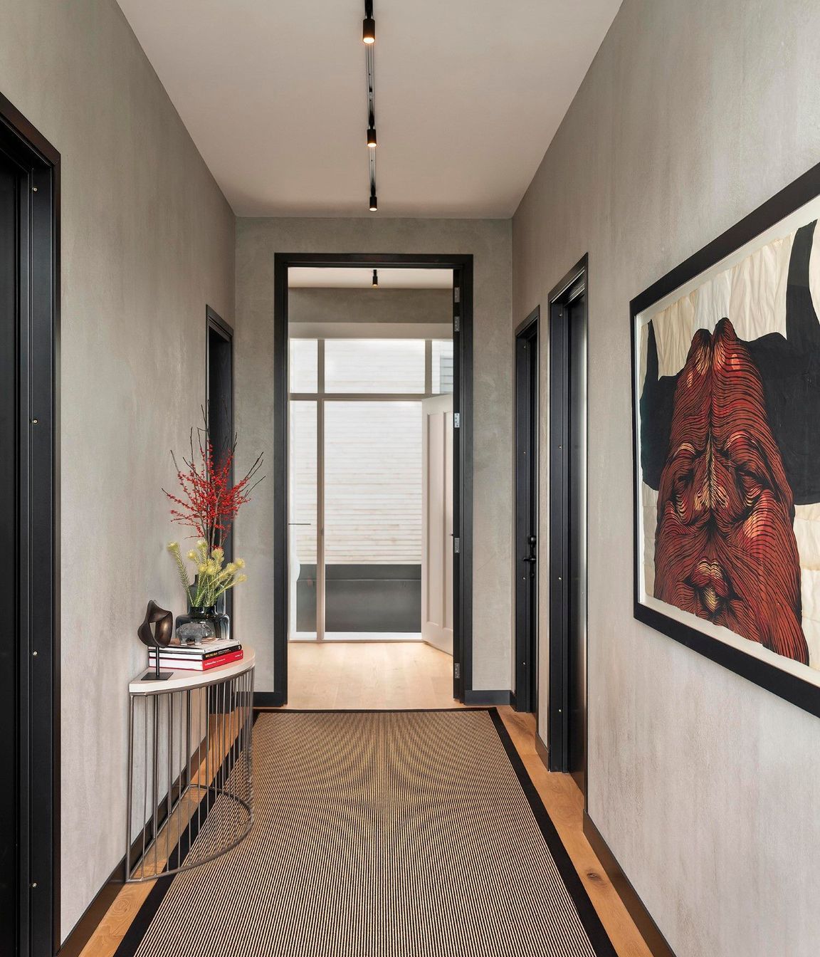 The entry hallway was elevated with textured walls and a fascinating bull artwork by David Ellis.
