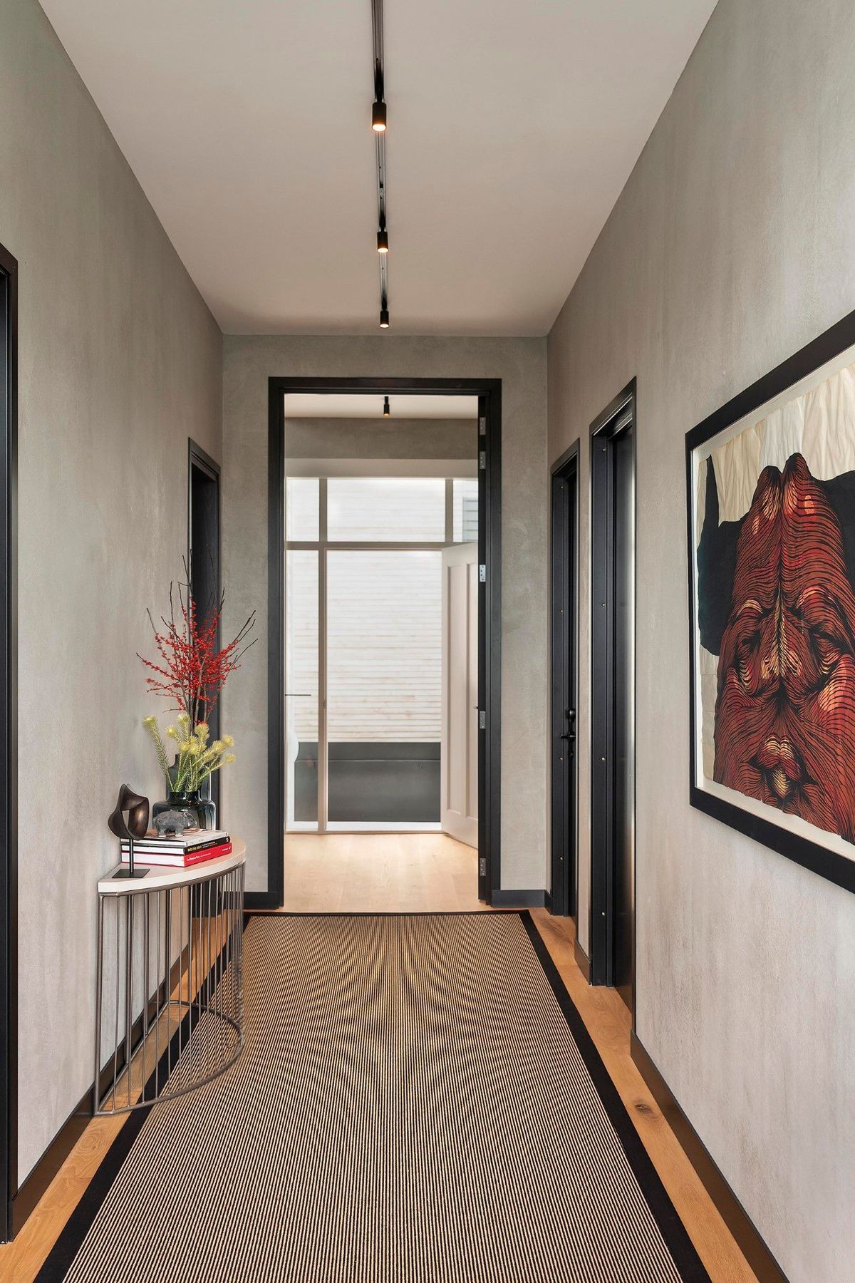 The entry hallway was elevated with textured walls and a fascinating bull artwork by David Ellis.