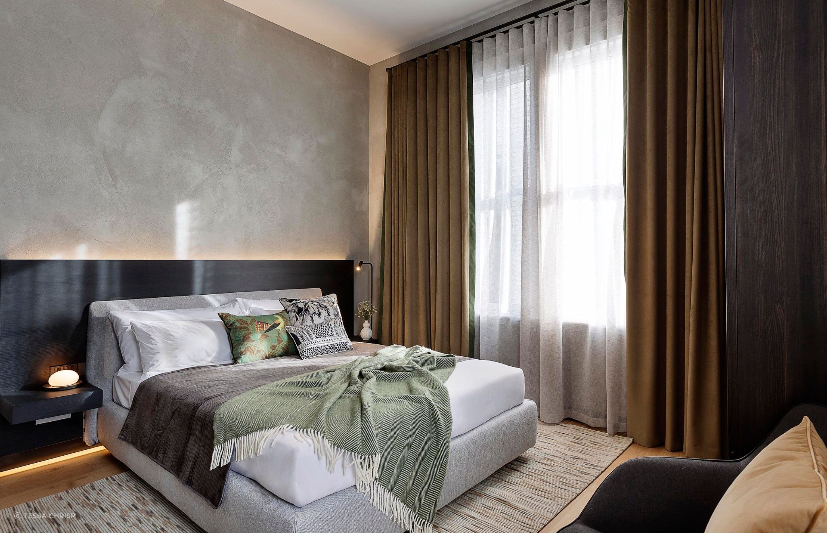 In this room, a contrast curtain colour lifts the room and gives it warmth.