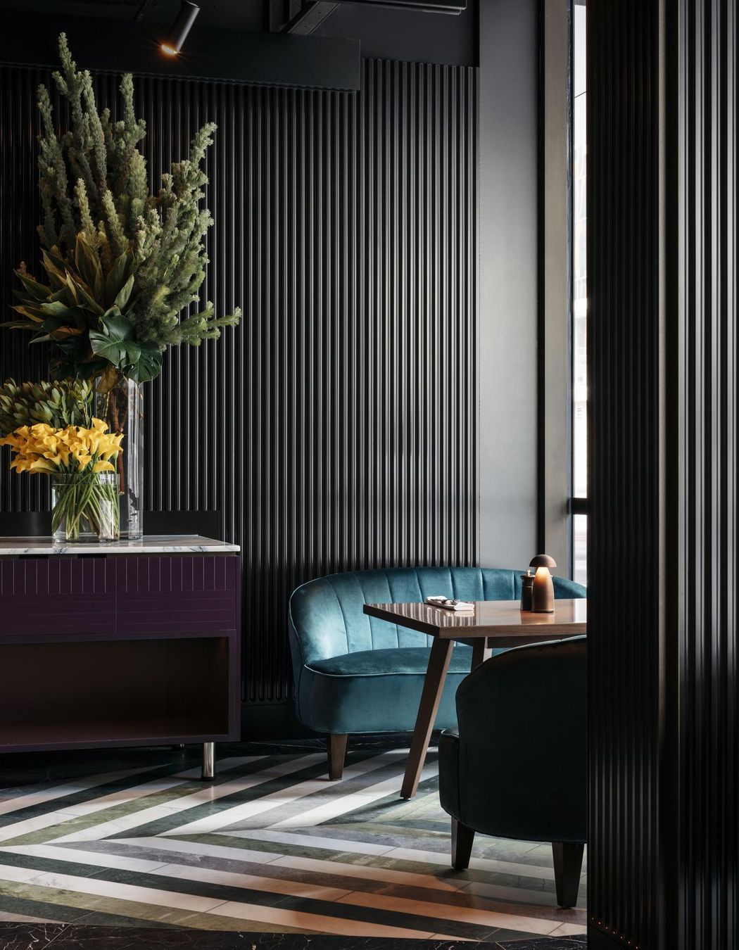 The lush rainforested courtyard atrium provides a natural refuge from the busy city.