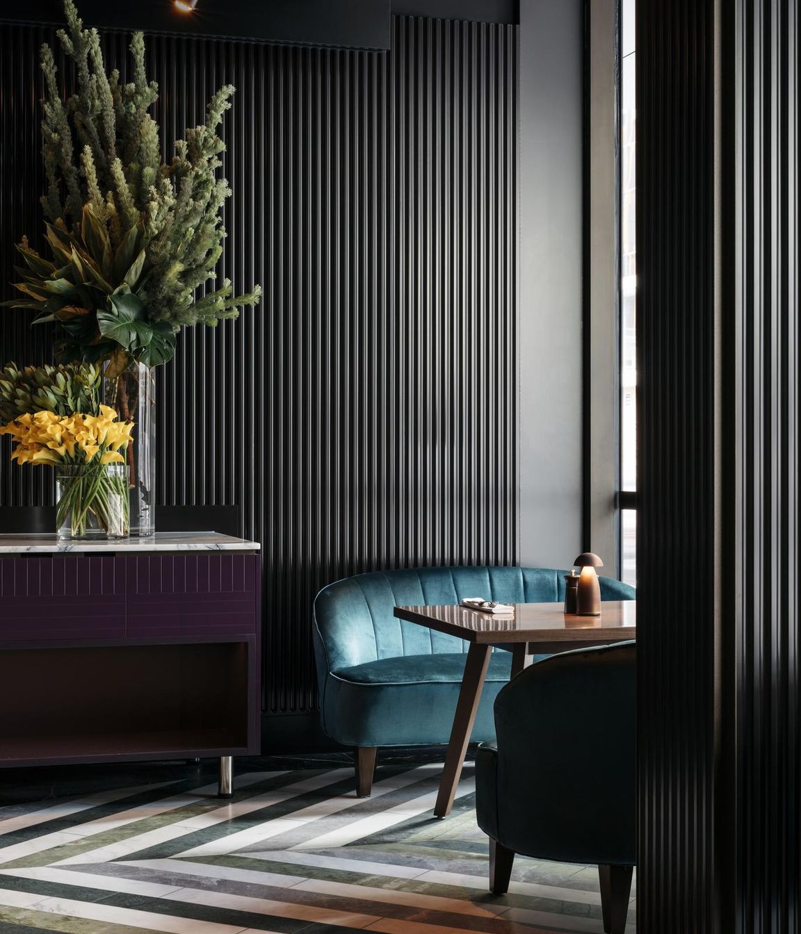 The lush rainforested courtyard atrium provides a natural refuge from the busy city.