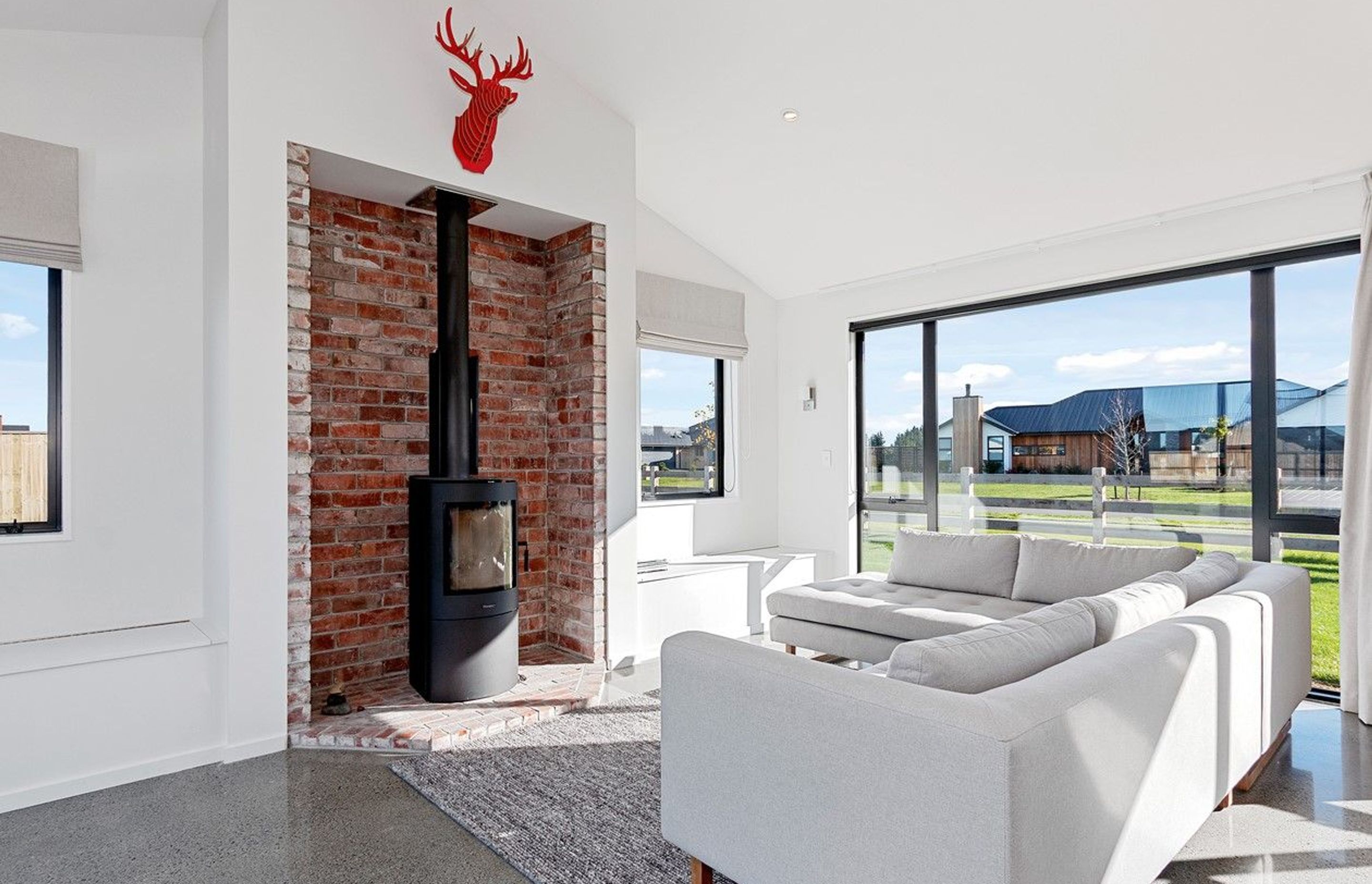 Supply and installation of Masport Akaroa log fire. Photo credit Homes by Parklane