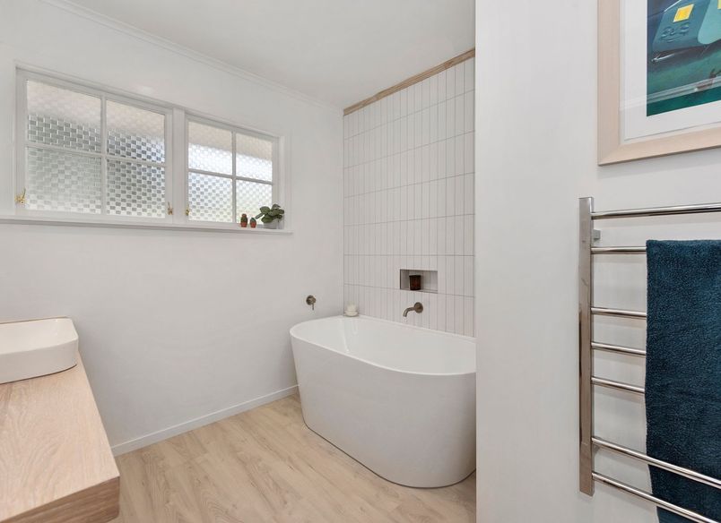 A Lovely Pair of Bathrooms and a Functional Laundry Unit