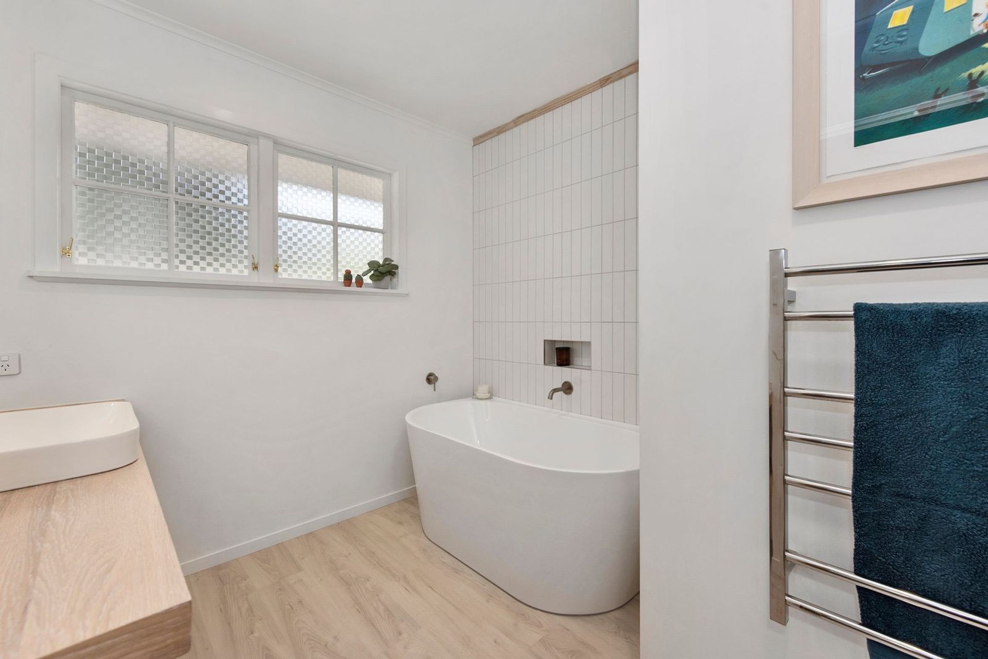 A Lovely Pair of Bathrooms and a Functional Laundry Unit
