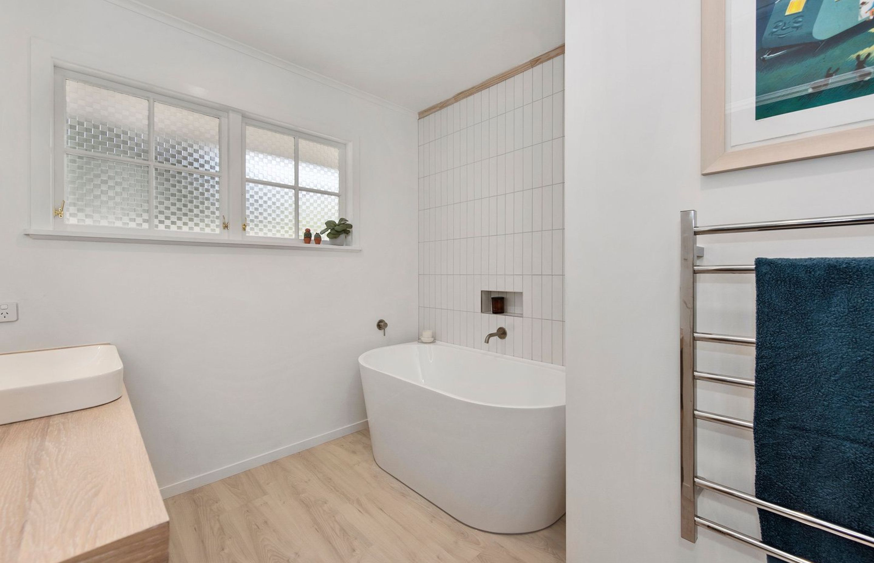 A Lovely Pair of Bathrooms and a Functional Laundry Unit