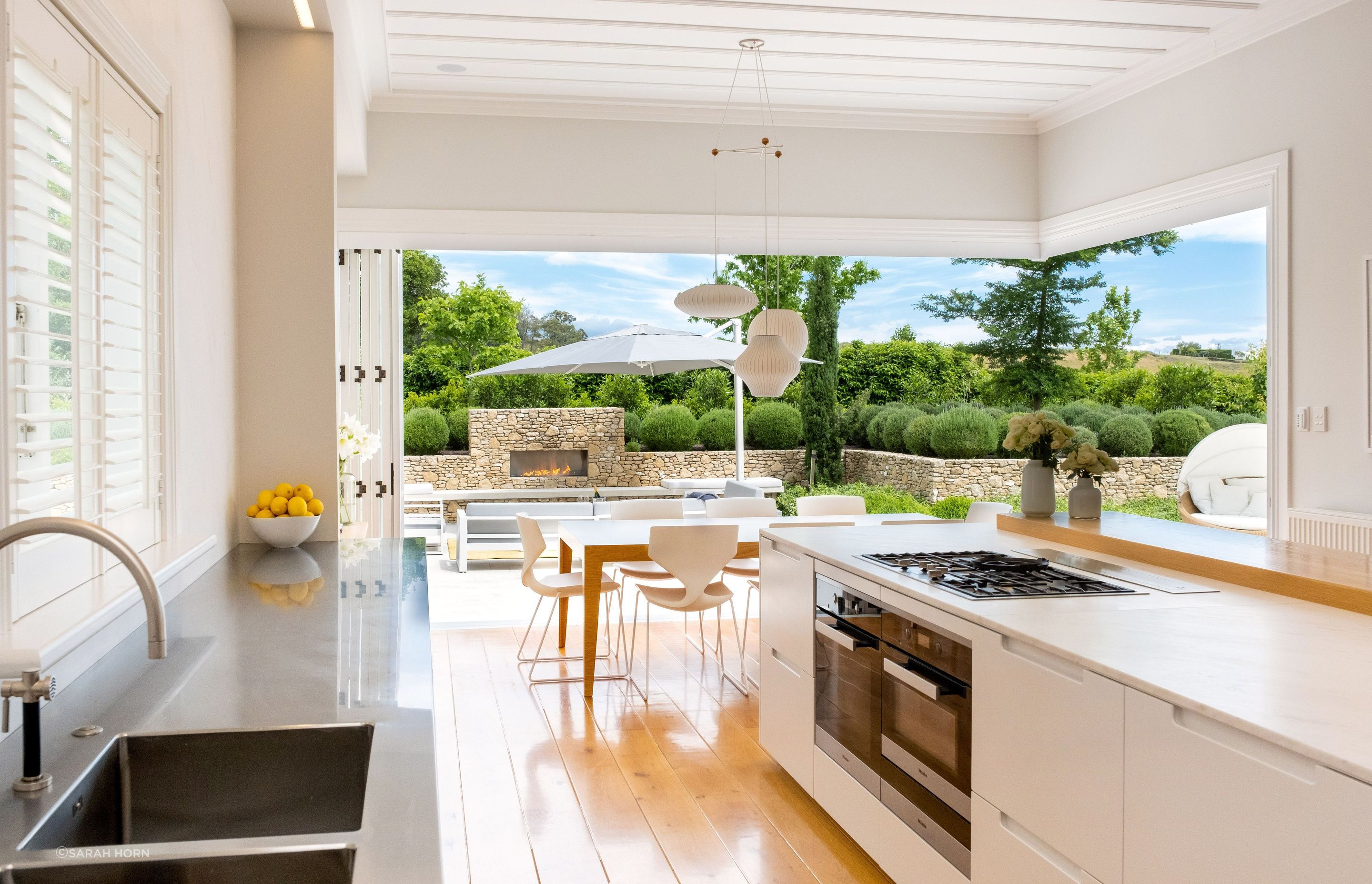 Hand-crafted modern kitchen supplied by Park Hill Joinery along with molded ceiling batons.