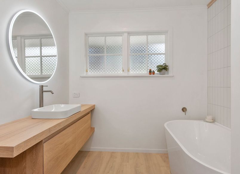 A Lovely Pair of Bathrooms and a Functional Laundry Unit