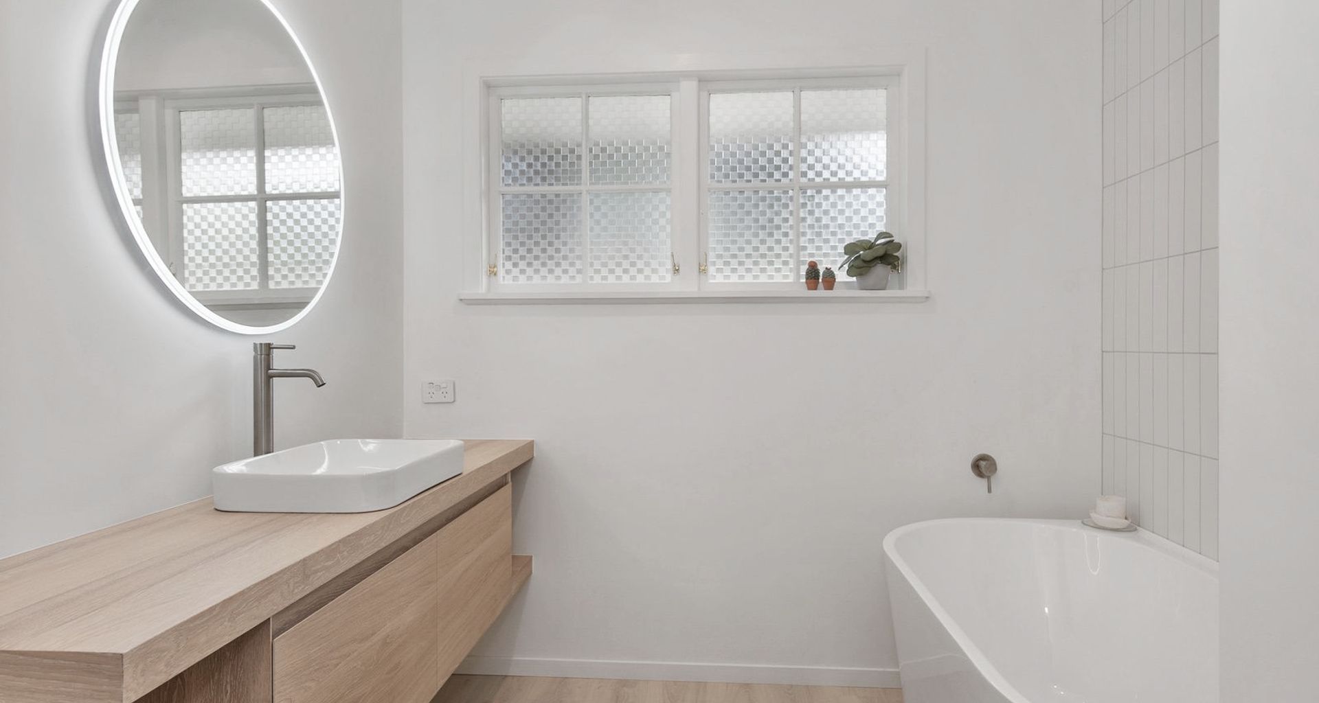 A Lovely Pair of Bathrooms and a Functional Laundry Unit banner