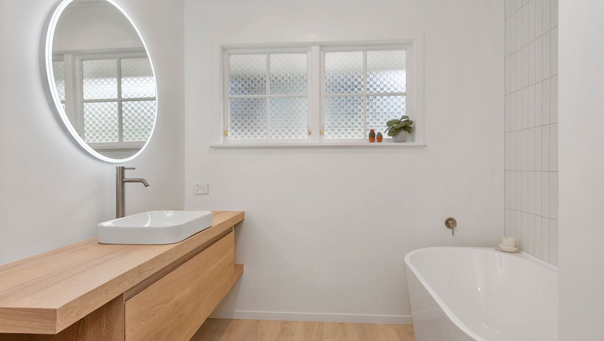 A Lovely Pair of Bathrooms and a Functional Laundry Unit banner