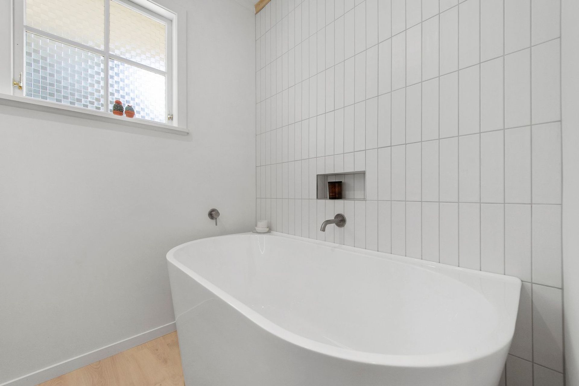 A Lovely Pair of Bathrooms and a Functional Laundry Unit