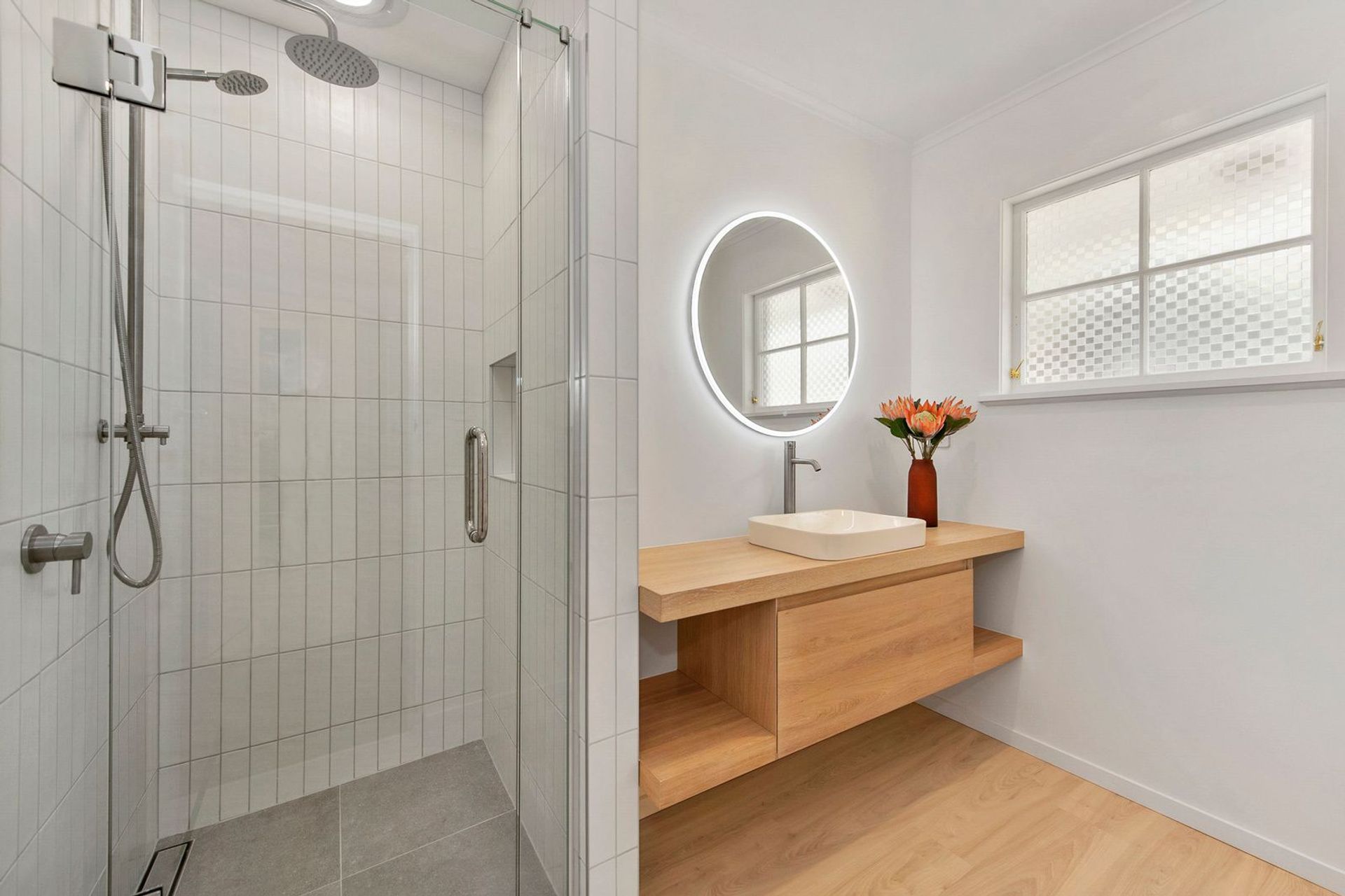 A Lovely Pair of Bathrooms and a Functional Laundry Unit