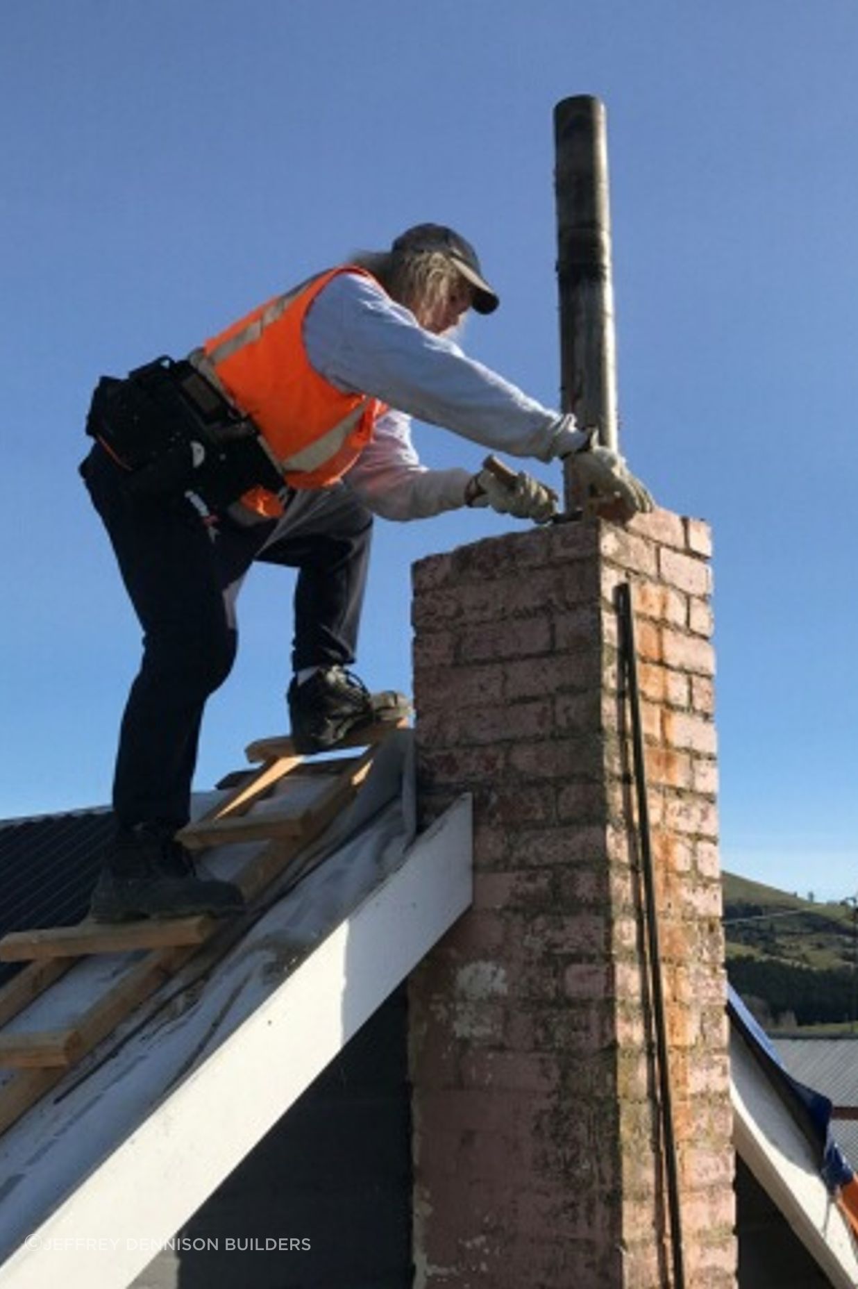 Removing the old damaged chimney down to roof level