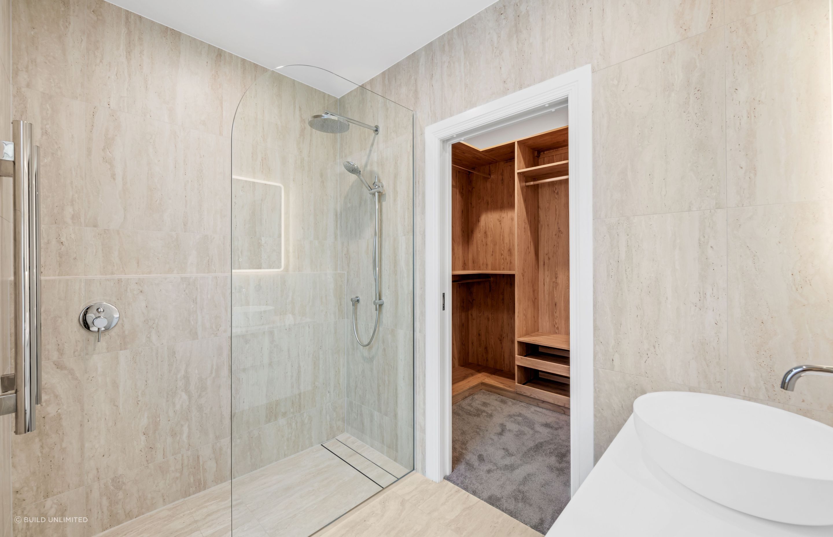This ensuite was built from scratch. Flush-entry shower, tiled floor to ceiling, and finishes that keep it feeling clean and calm, every day.
